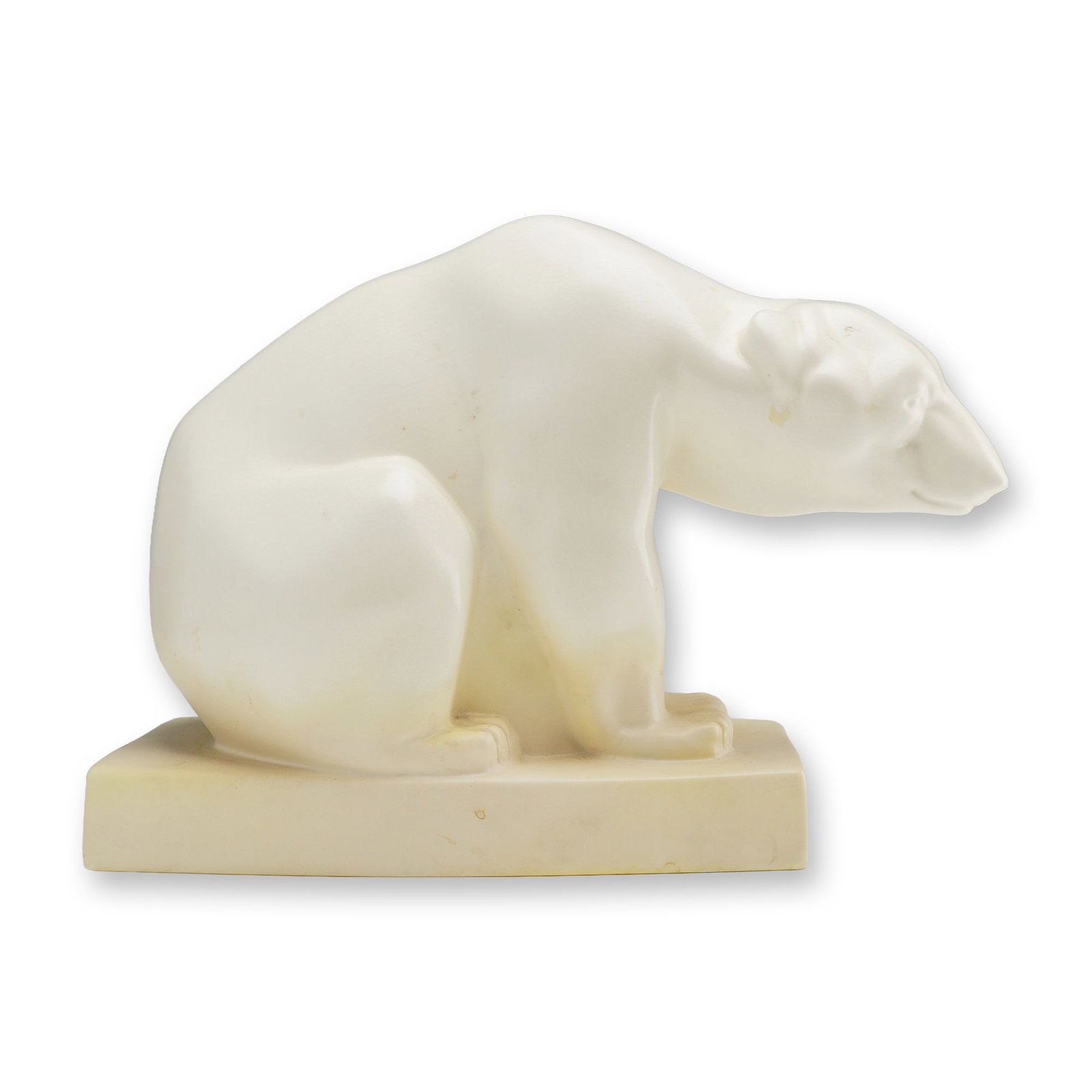 John Skeaping for Wedgwood Art Deco Moonstone Glazed Polar Bear Figure: A ceramic animalier sculpture of a polar bear designed by John Skeaping for Wedgwood, circa 1930. The figure is rendered in a stylized modernist form with simplified anatomical details, depicted in a 