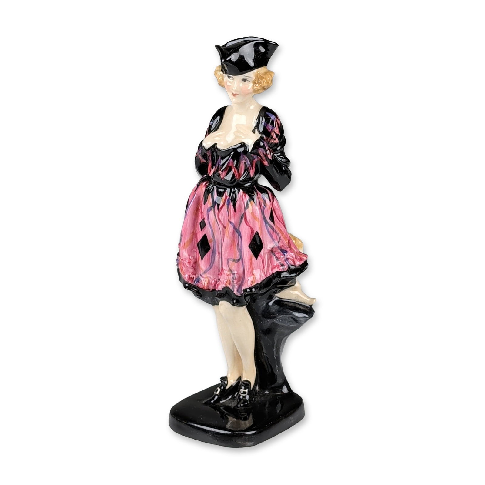 Royal Doulton Porcelain Art Deco Figurine, Mam’selle HN786: Designed by Leslie Harradine. This Art Deco style figure is depicted in a black hat and bodice with a full pink skirt featuring black diamond motifs and vertical purple striations, cradling a small nu