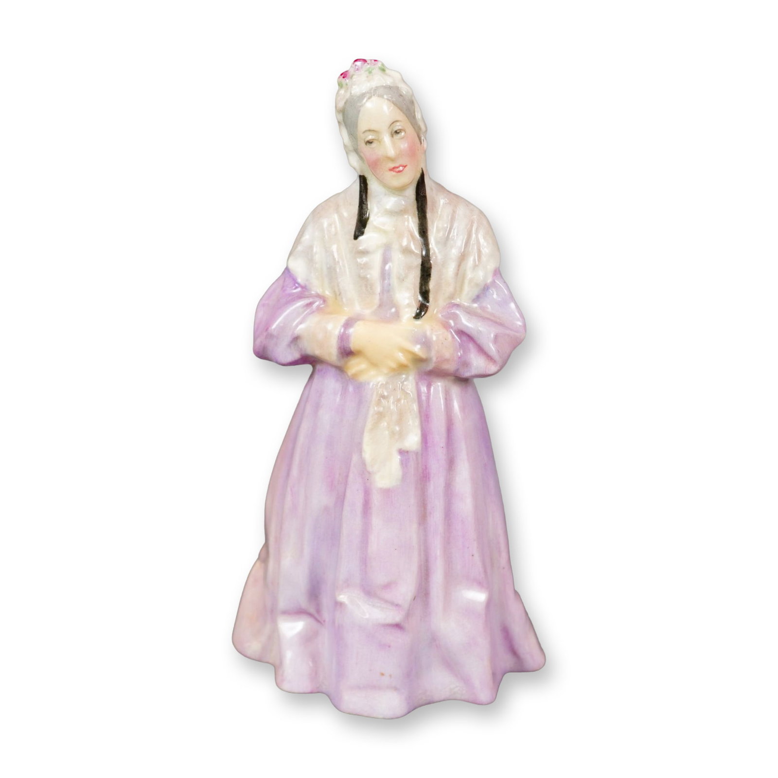 Royal Doulton Porcelain Figurine, Charley’s Aunt HN1703: Part of the Literary Characters series. Designed by Albert Toft. Hand painted, depicts an elderly woman in a lilac and white dress. Royal Doulton backstamp. Artist: Albert Toft Dimensions: 3.25"L x 3.