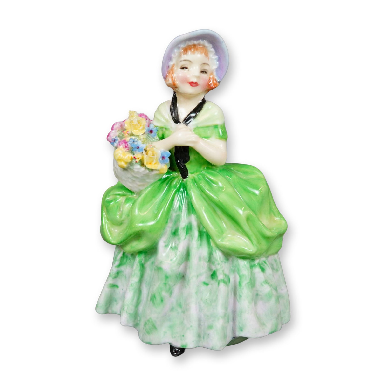 Royal Doulton Bone China Figurine, Cissie HN1808: Hand painted figure of a young girl in a green dress and light blue bonnet, holding a basket of flowers. Royal Doulton backstamp. Artist: Leslie Harradine Dimensions: 3.25"L x 2.75"W x 5.25"H Manufact