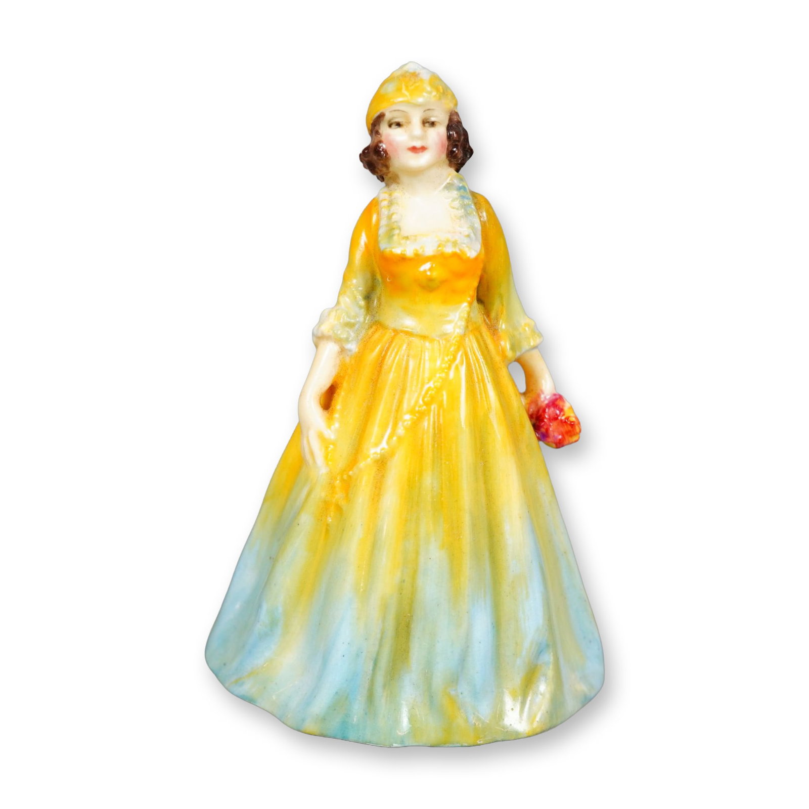 Royal Doulton Figurine, Rosamund M32: Hand painted figure of a young woman in a yellow dress with light blue accents. She is shown holding pink and yellow flowers. Royal Doulton backstamp. Dimensions: 2.75"L x 2.5"W x 4.25"H Manufacturer 