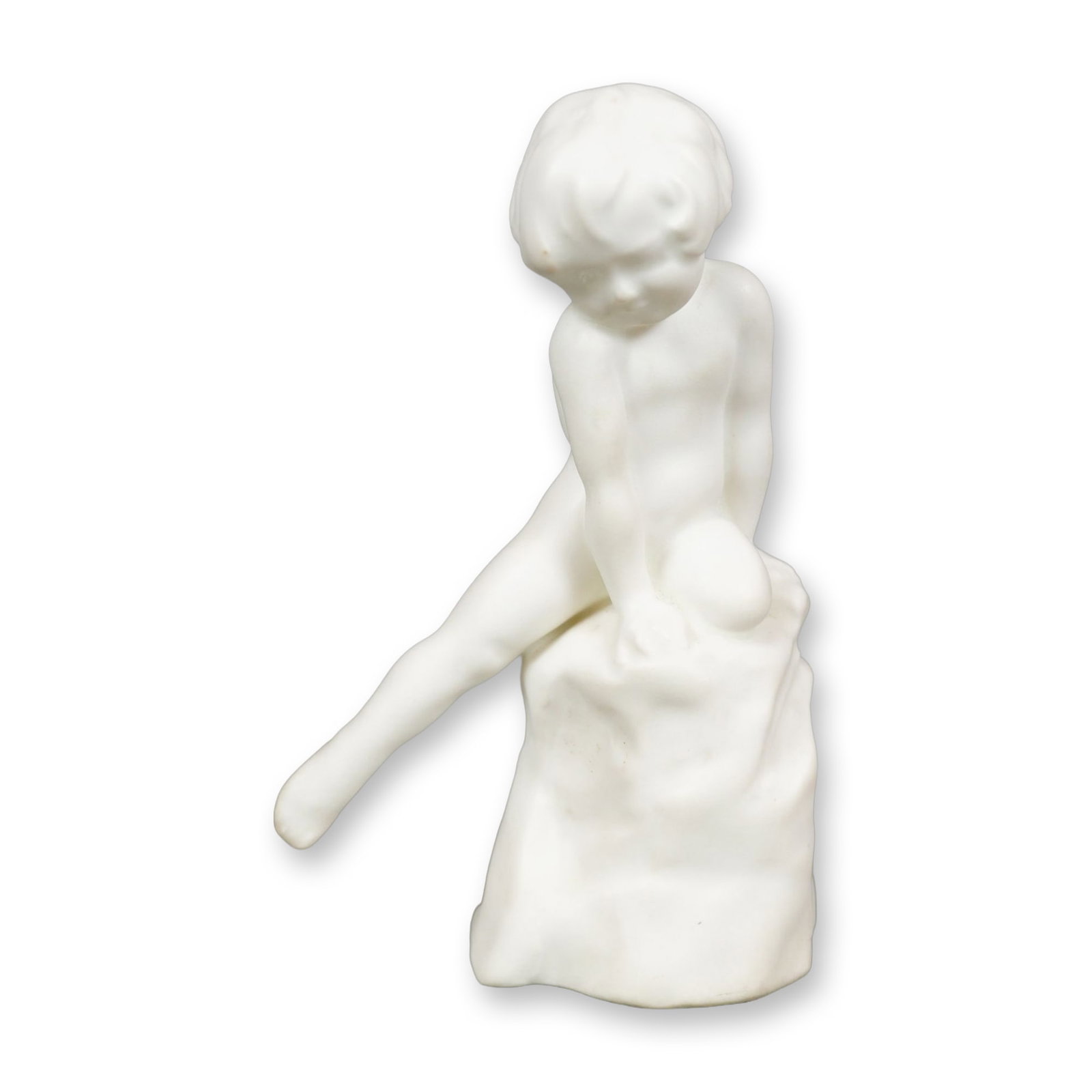 Royal Doulton Experimental Matte Finish Porcelain Figurine, Child Study HN603A: A white matte figure depicting a child seated on a rock with the right leg extended outward. While Child Study HN603A was also produced in versions decorated with floral motifs, this undecorated examp