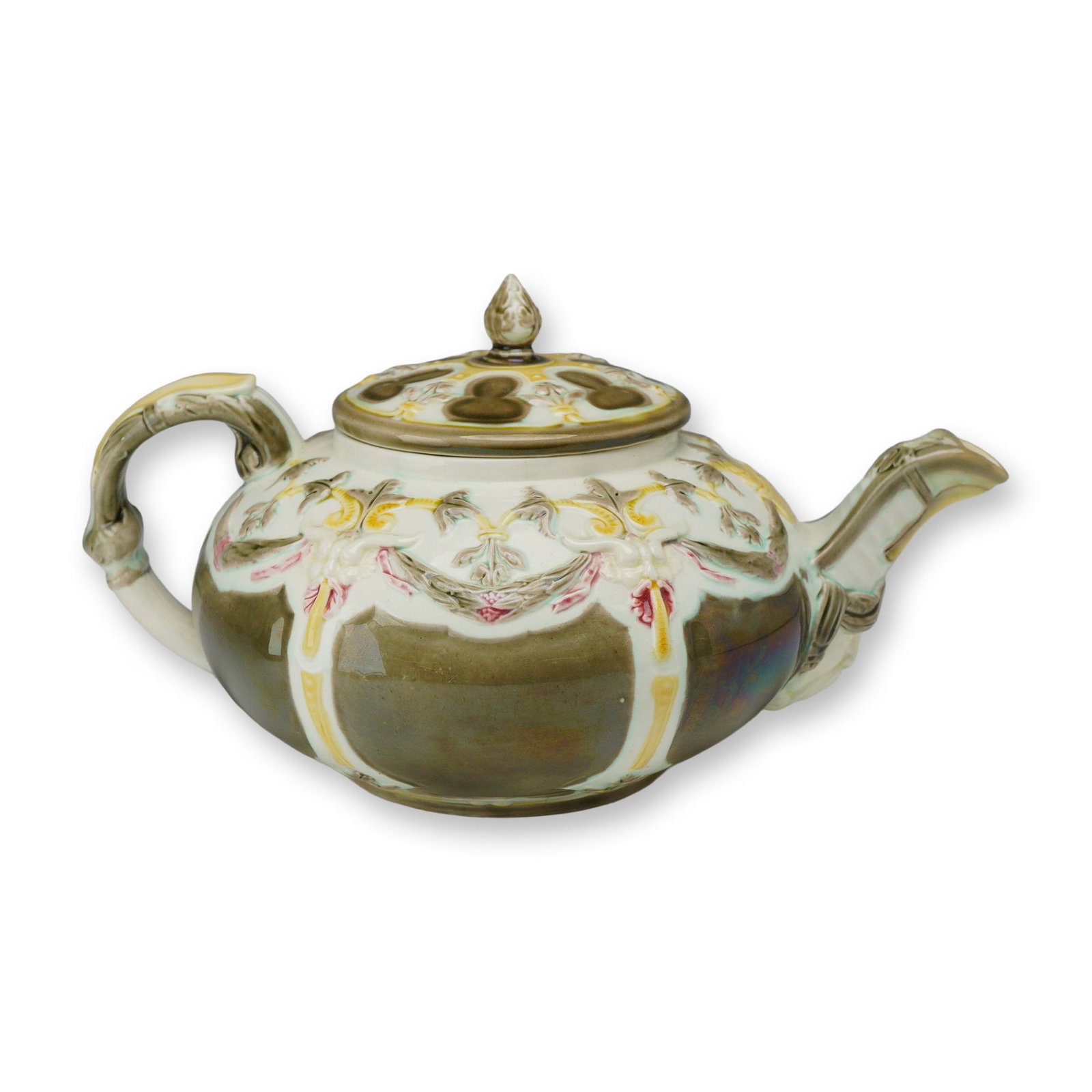 Wedgwood Majolica Luster Glazed Teapot and Cover: A Wedgwood lead-glazed earthenware (Majolica) teapot and matching cover featuring a bulbous form. The upper portion of the body is decorated with high-relief molded floral and foliate swags, finished 