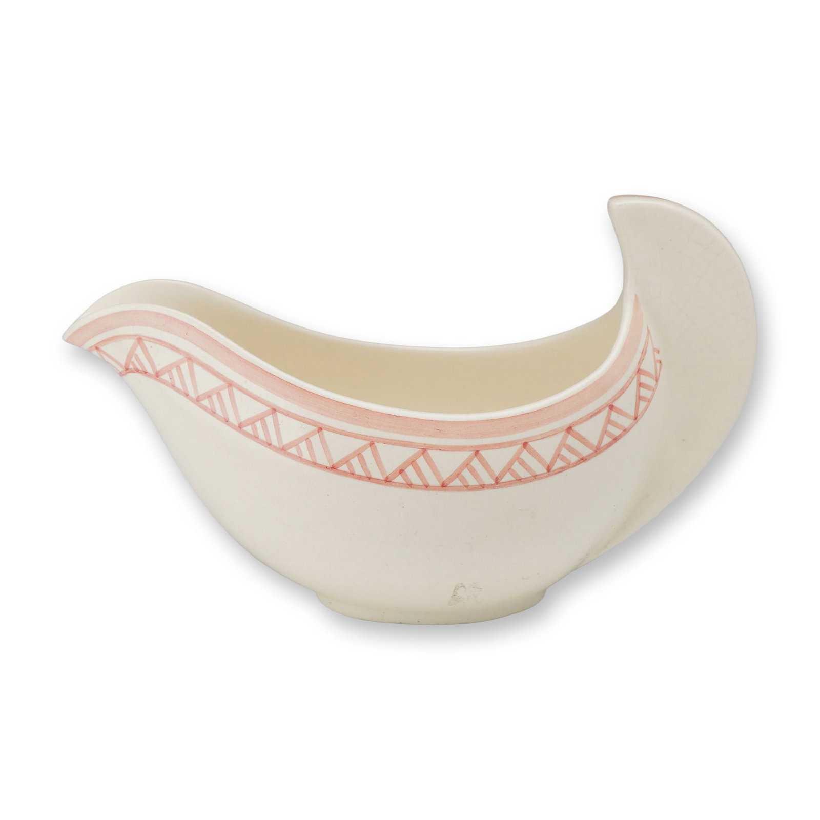 Wedgwood Moonstone Earthenware Sauce Boat in the Paris Shape and Vandyke Pattern: A Wedgwood earthenware sauce boat executed in the Art Deco Paris shape, characterized by a high, sweeping fin-like handle and an elongated pouring spout. The vessel is finished in Moonstone, a matte o