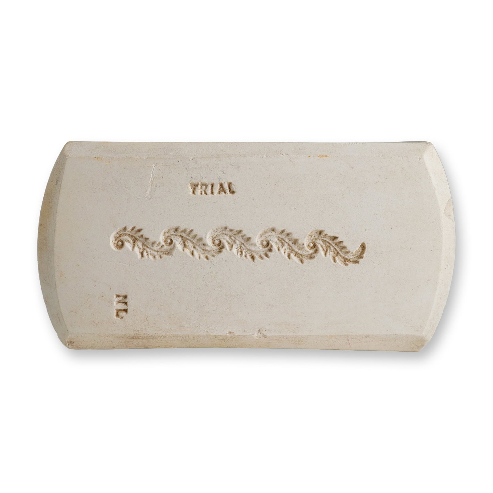 Wedgwood White Stoneware Trial Sprig Mold: This is a rectangular, slightly cambered ceramic sprig or pitch mold manufactured by Wedgwood. It is composed of a dense, unglazed white stoneware or earthenware body. The center of the top face featu