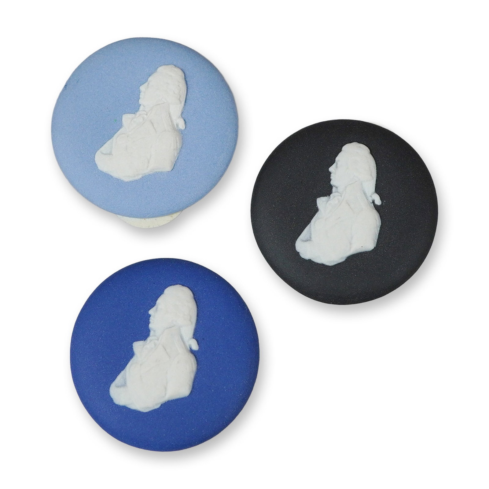 3pc Wedgwood Jasperware Portrait Medallions: This lot consists of a trio of unglazed jasperware stoneware medallions manufactured by Wedgwood in England. Each circular medallion features a white bas-relief profile portrait of a gentleman, identi