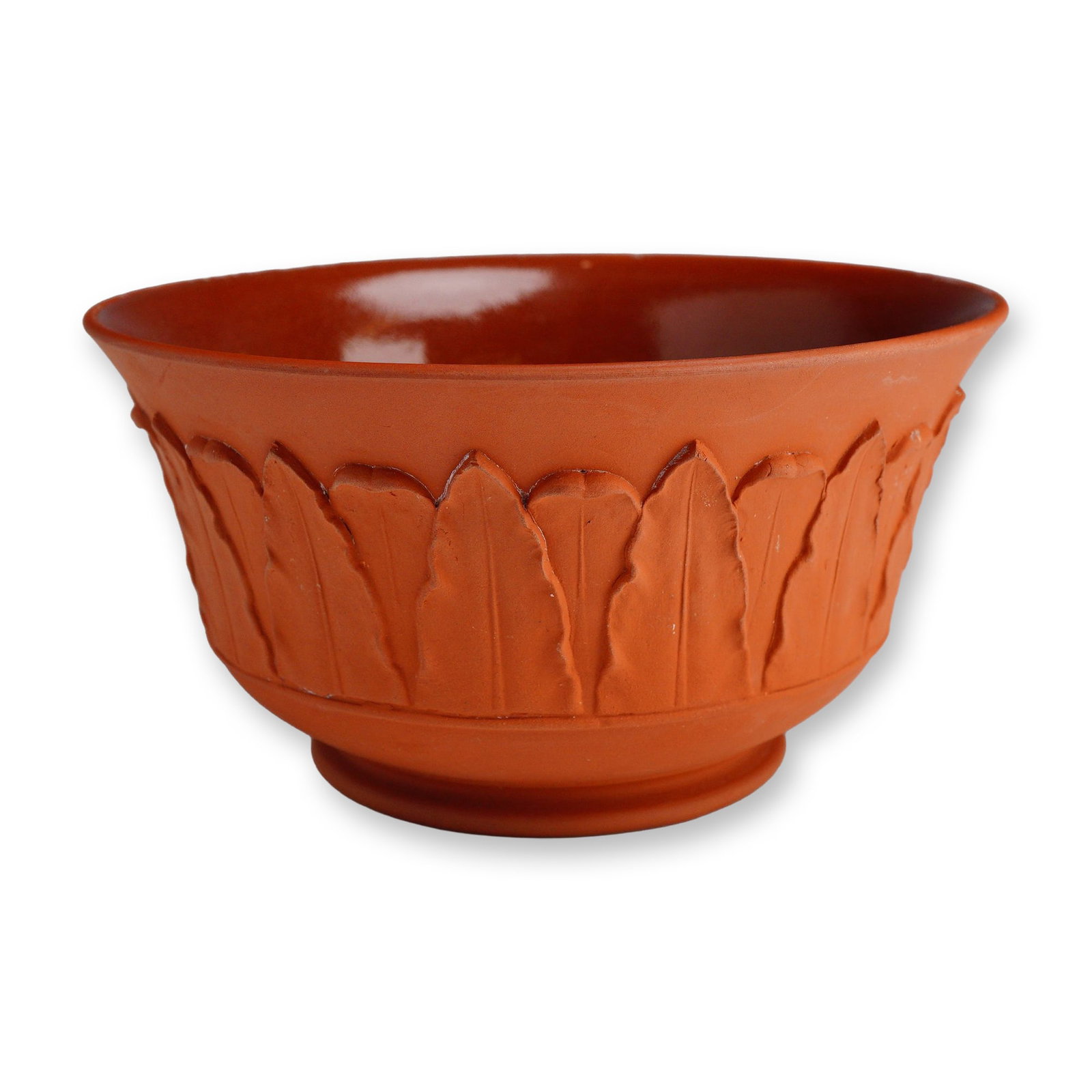 Wedgwood Rosso Antico Terra Cotta Color Layered Leaf Design Bowl: This Wedgwood bowl is crafted from Rosso Antico, a fine-grained red stoneware with a terra cotta color. The circular form features a flared rim and a low foot ring. The exterior surface is matte and d