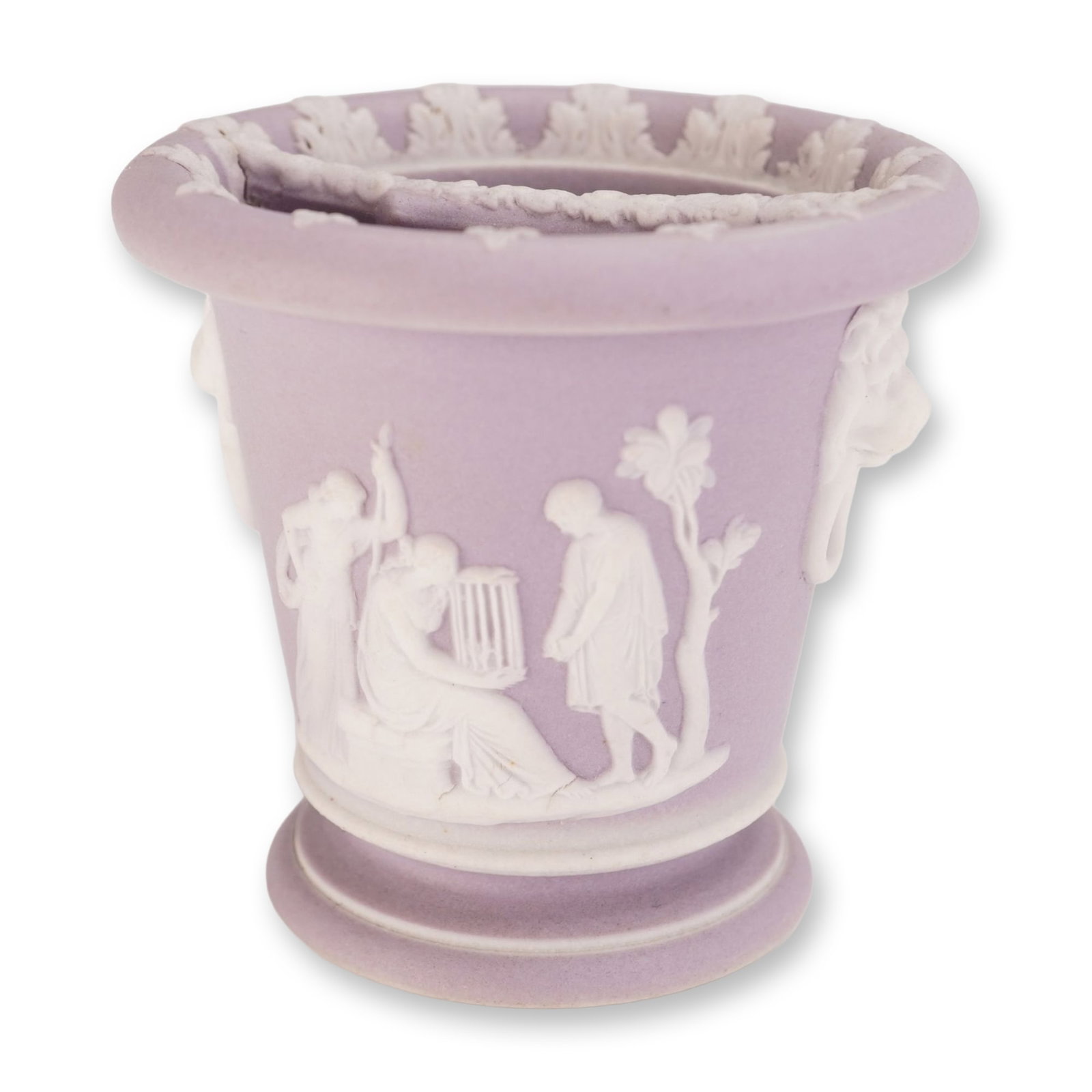 Wedgwood Lilac Jasperware Dip Classical Motif Vase: A mini vase in lilac jasperware dip featuring applied white bas-relief classical scenes. One side depicts a seated figure playing a lyre accompanied by standing figures, while the reverse shows figure
