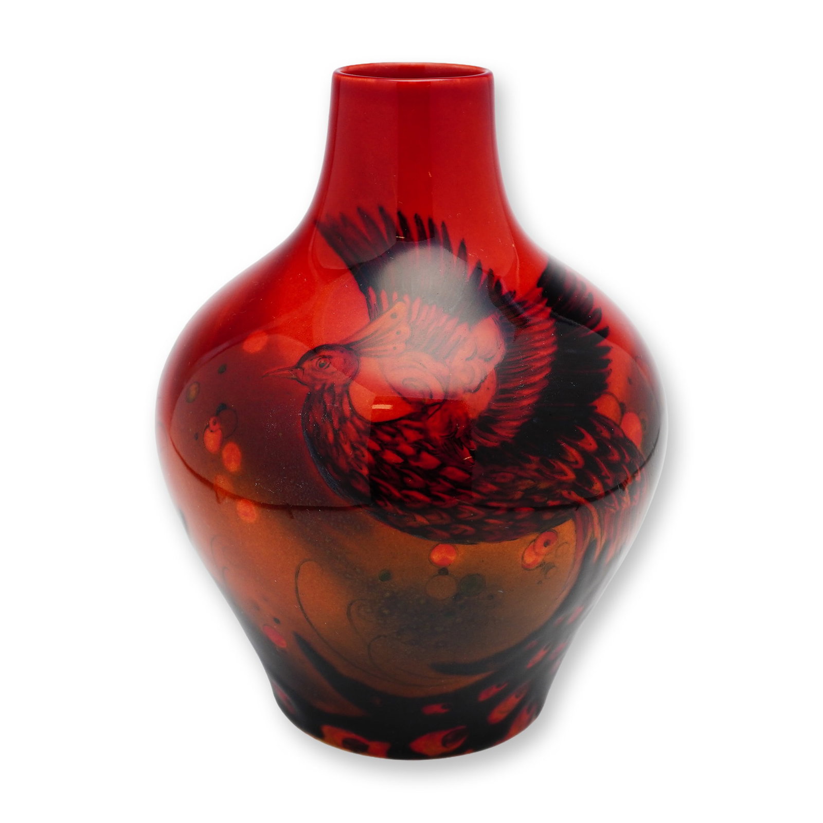 Royal Doulton Sung Flambe by Fred Moore Peacock Vase: Small, stout-bodied vase in red-fired earthenware with a short neck, decorated in black with a majestic peacock, highlighted by yellow accents. Marked with the Royal Doulton Flambé and Sung stamps. A
