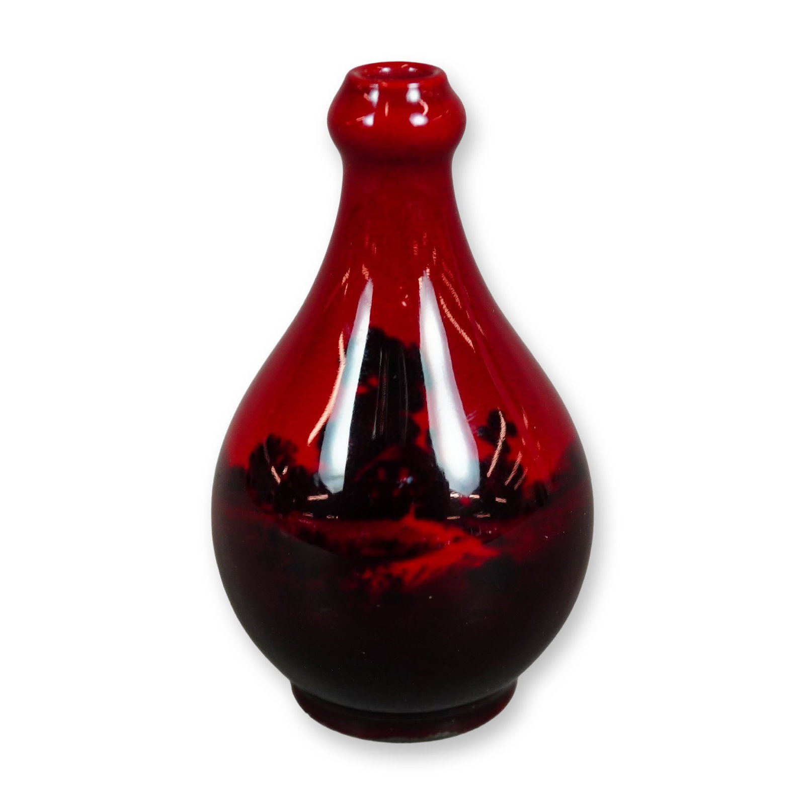 Royal Doulton Flambe Miniature Vase, Cottage Scene: A small vase in a red-fired flambe glaze, decorated with a black scenic countryside motif depicting a cottage. Marked with the Royal Doulton Flambe backstamp. Dimensions: 1.75"W x 2.75"H Manufacturer 