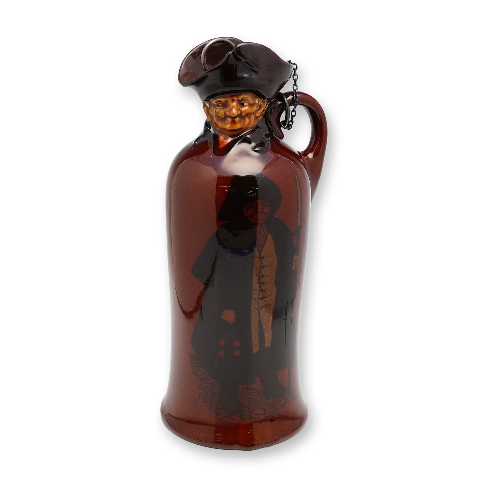 Royal Doulton and George Betjemann & Sons Sterling Silver Kingsware Flask, The Watchman: The molded spout is formed as the detailed head of the Watchman, wearing a tricorn hat, while the body is decorated with a hand-painted full-length figure of the night guard holding his staff, a tradi