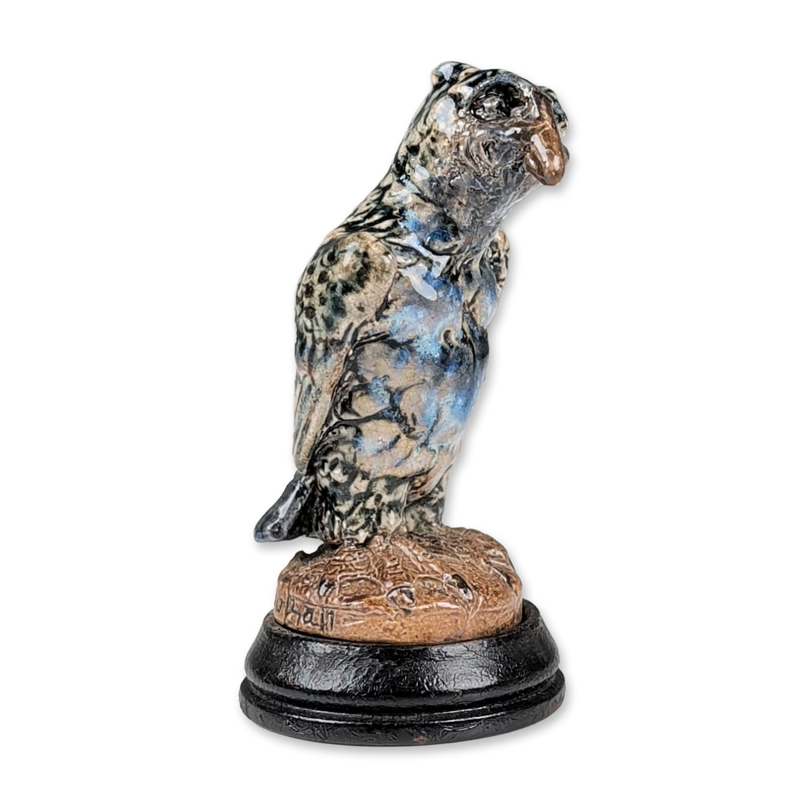 Martin Brothers Salt Glazed Stoneware Grotesque Bird Figurine: Martin Brothers salt glazed stoneware miniature bird figurine, dated 1913. The bird is modeled in a perched posture on a textured rocky mount base, finished in a mottled blue, cream, and brown salt gl