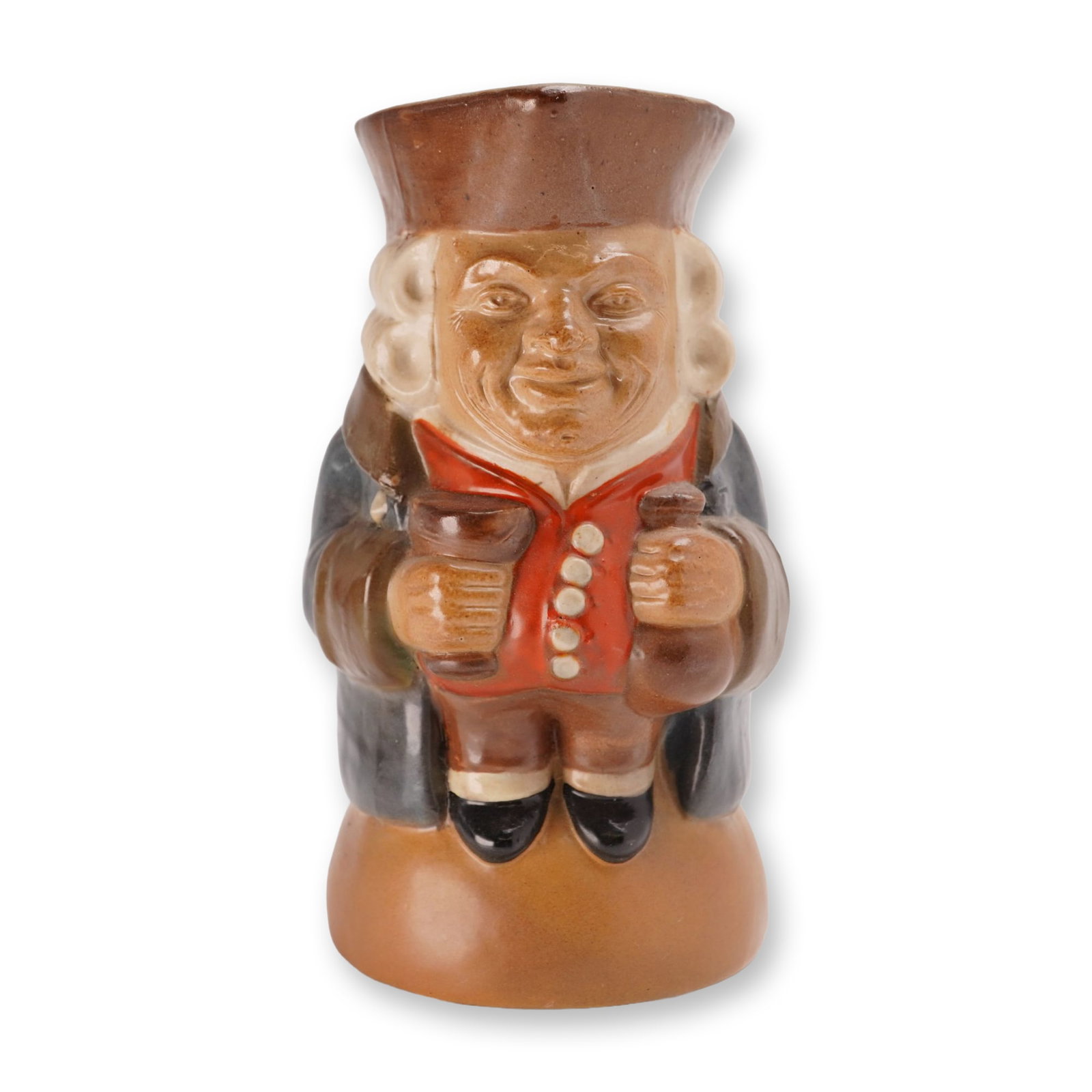 Royal Doulton Lambeth Simeon Toby Jug: Depicting a standing male figure in traditional 18th-century attire. The figure is modeled wearing a brown tricorn hat that forms the rim and spout, a red waistcoat with white buttons, a dark coat, an