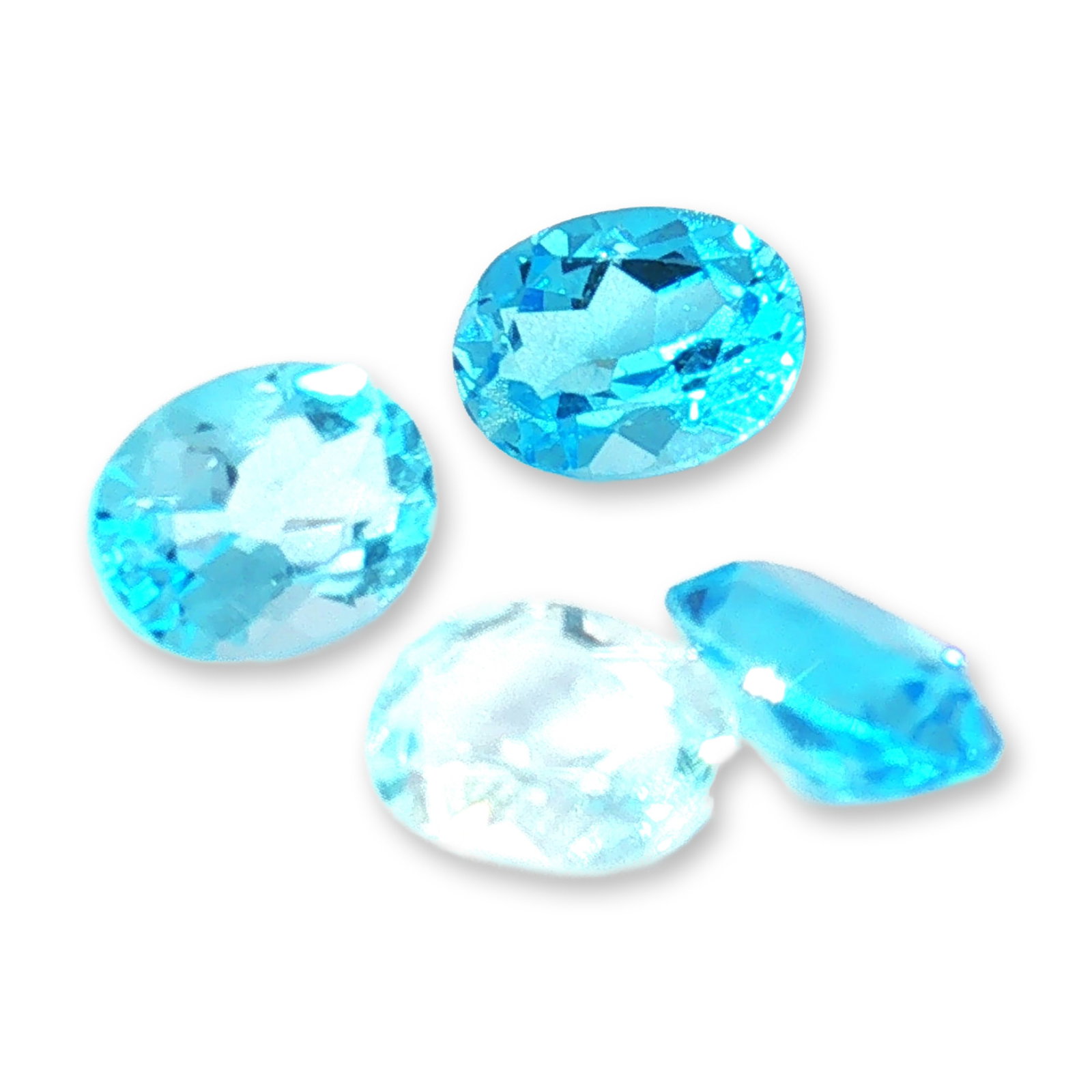 4pc Oval Blue Topaz Gemstones: Grouping of 4 Blue Topaz stones weighting 1.29-1.69cts. Blue topaz is a striking, durable semi-precious gemstone known for its glassy luster and excellent clarity. Blue topaz meaning, in particular, i