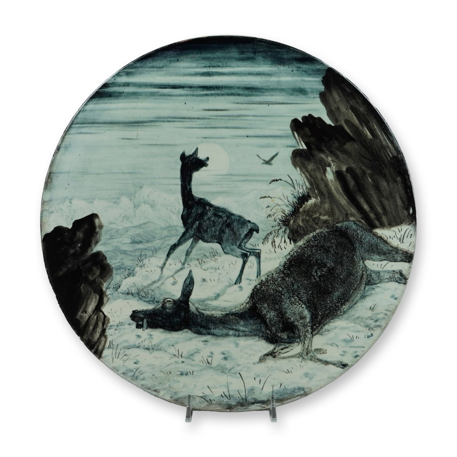 Henry Hope Crealock, The Motherless Bairn, 1874: This large ceramic charger features a hand-painted monochrome landscape scene executed in tones of grey, black, and blue-green. The central composition, titled The Motherless Bairn on the reverse, dep