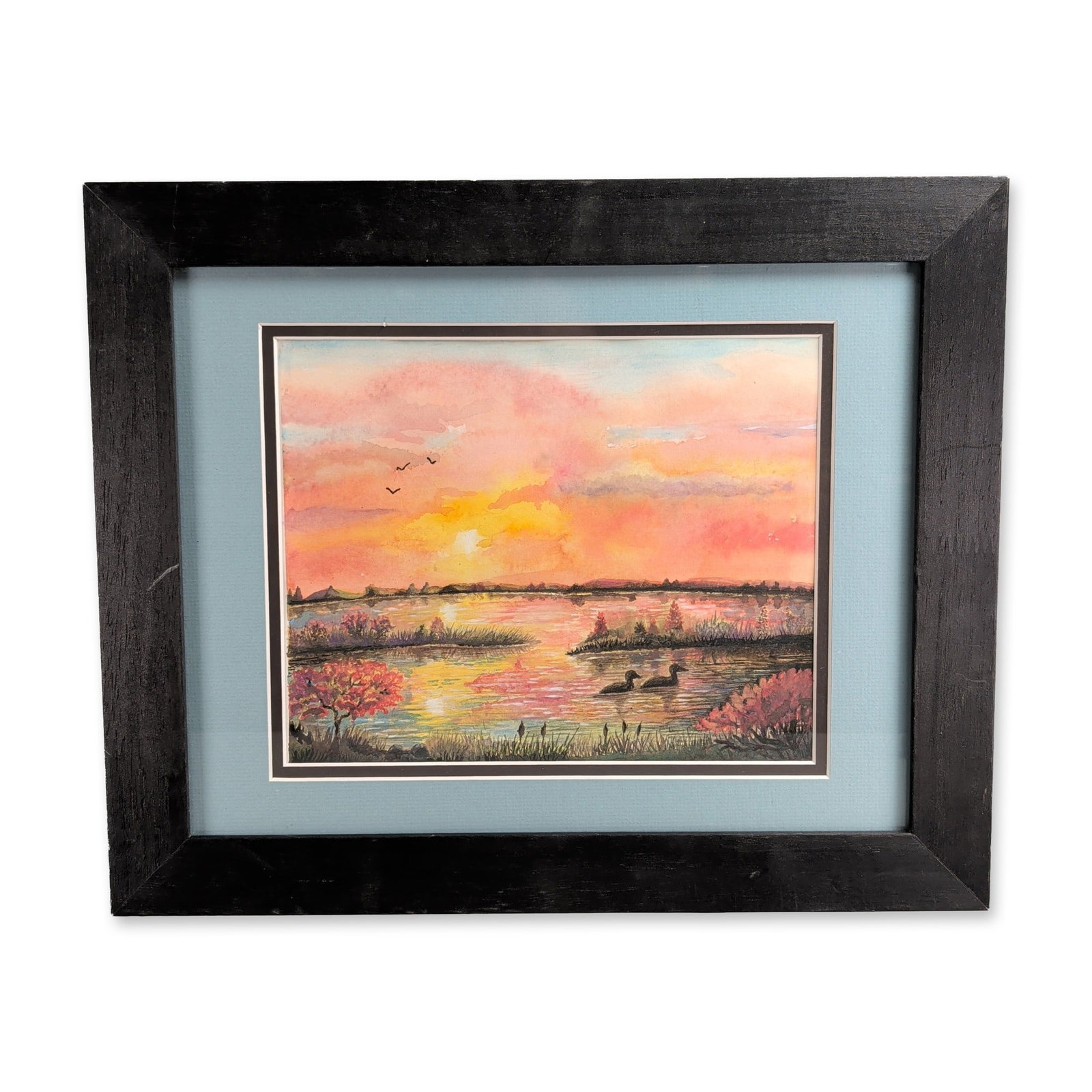 Watercolor on Paper Contemporary Wetland Sunset Landscape: Watercolor on paper depicting a tranquil wetland landscape at sunset, featuring layered washes of pink and orange light mirrored across a central body of water. The scene includes waterfowl swimming i