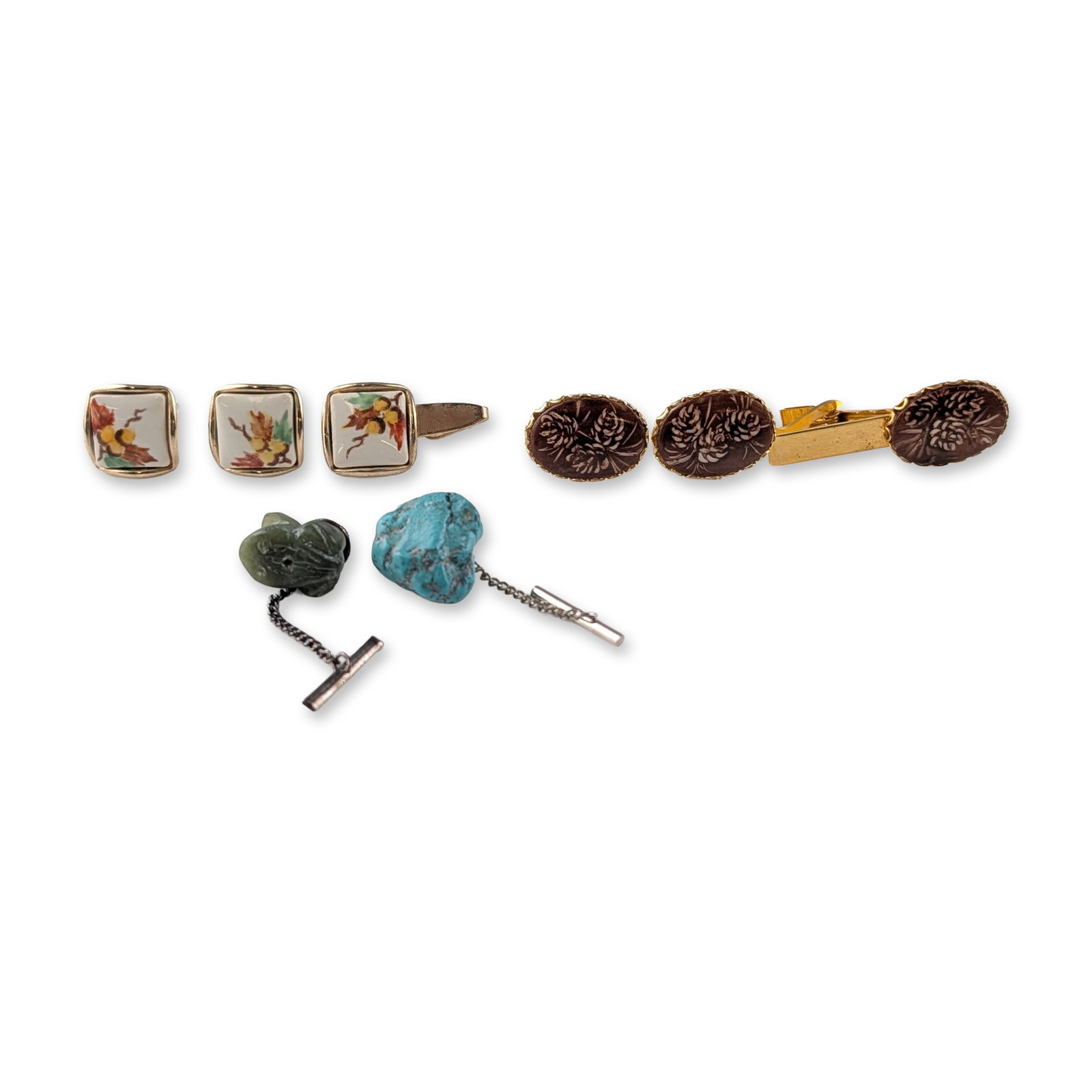 8pc Collection of Vintage Men's Accessories - Cufflinks, Tie Pins and Tie Clips: Group of vintage men's jewelry accessories in yellow-tone metal. The collection features square cufflinks with white ceramic or enamel inserts decorated with a multi-colored leaf and berry motif. A ma