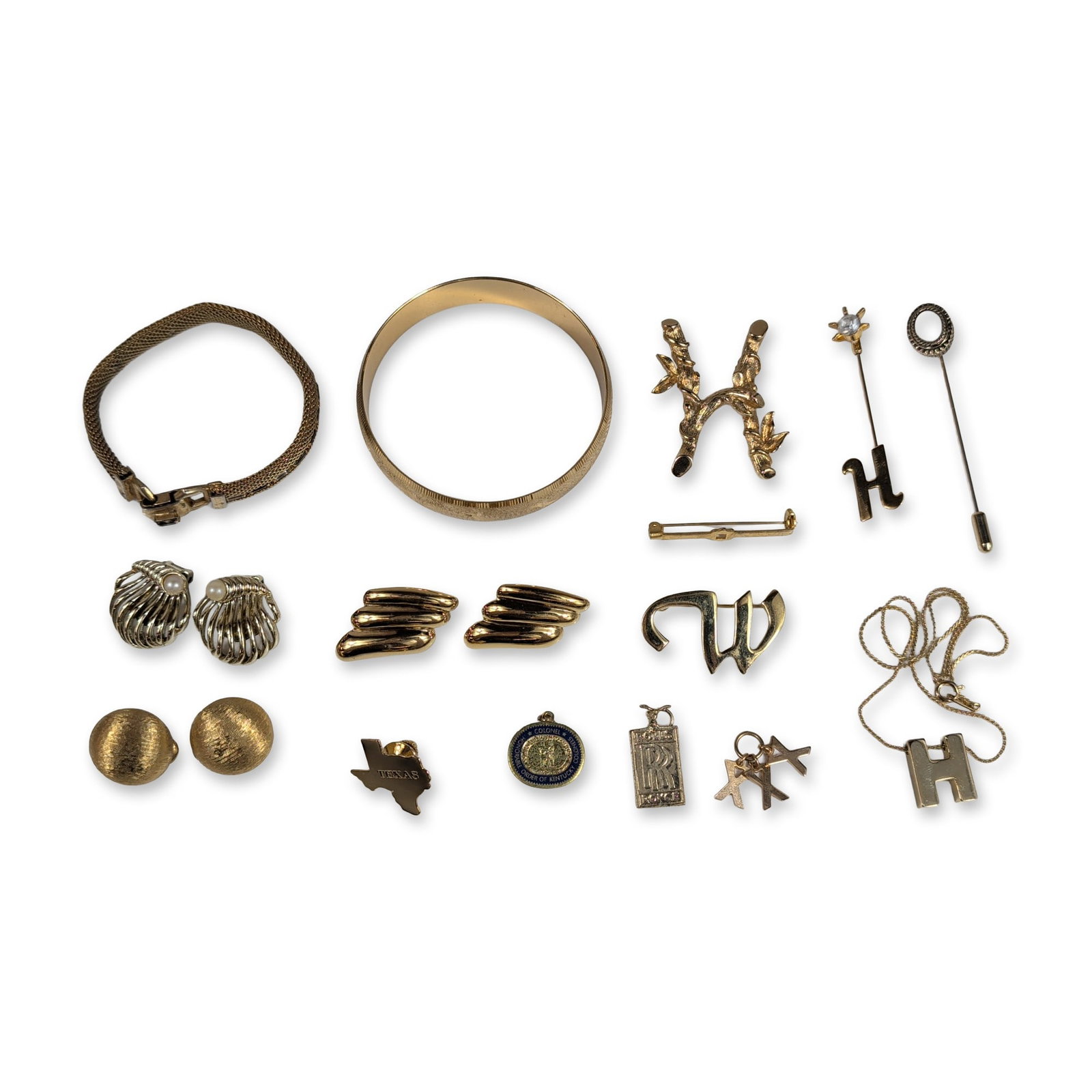 18pc Collection of Gold-Tone Costume Jewelry: An assortment of gold-tone costume jewelry and accessories including bracelets, brooches, earrings, and pendants. The group features a mesh bracelet with a buckle clasp, a textured bangle, and three b