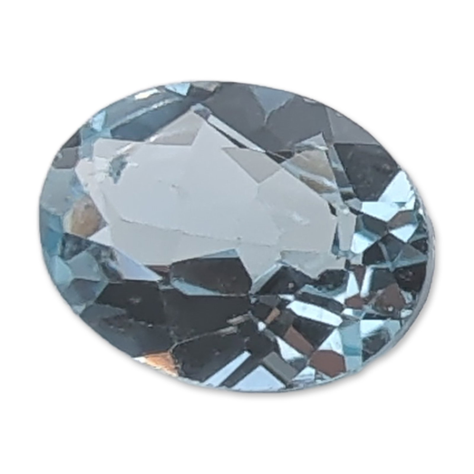 Faceted Light Blue Oval Topaz Gemstone: Faceted gemstone in transparent light sky blue, appearing consistent with aquamarine or sky blue topaz. The stone features an oval faceted cut with light-returning facets. 1.3 carats 7.9mm Dimensions: