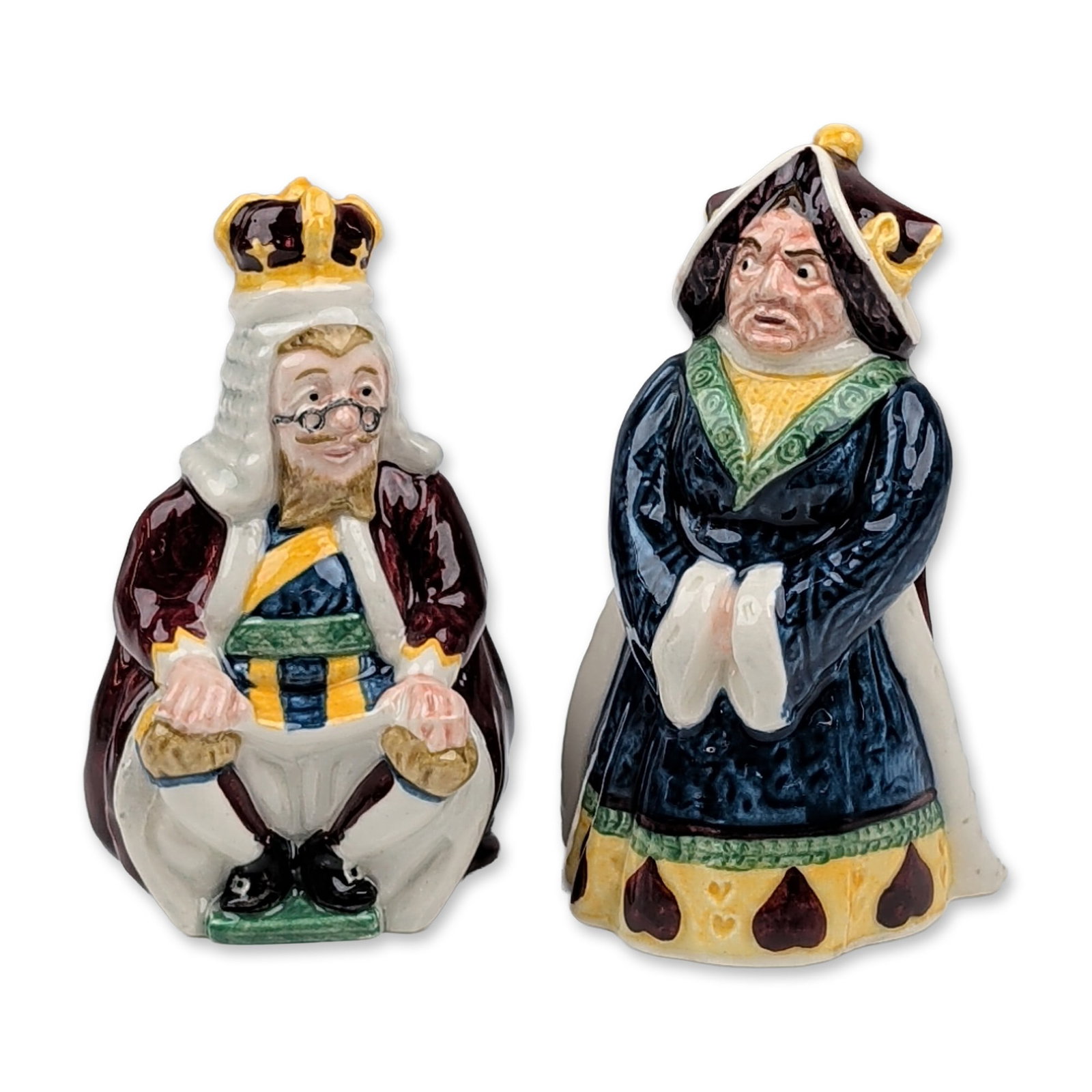 2pc Beswick English Ceramic Alice Series Figurines: Beswick (England, 1974). Pair of glazed polychrome ceramic figurines from the Alice Series, depicting the King of Hearts and the Queen of Hearts. The Queen is modeled in a standing pose wearing a dark