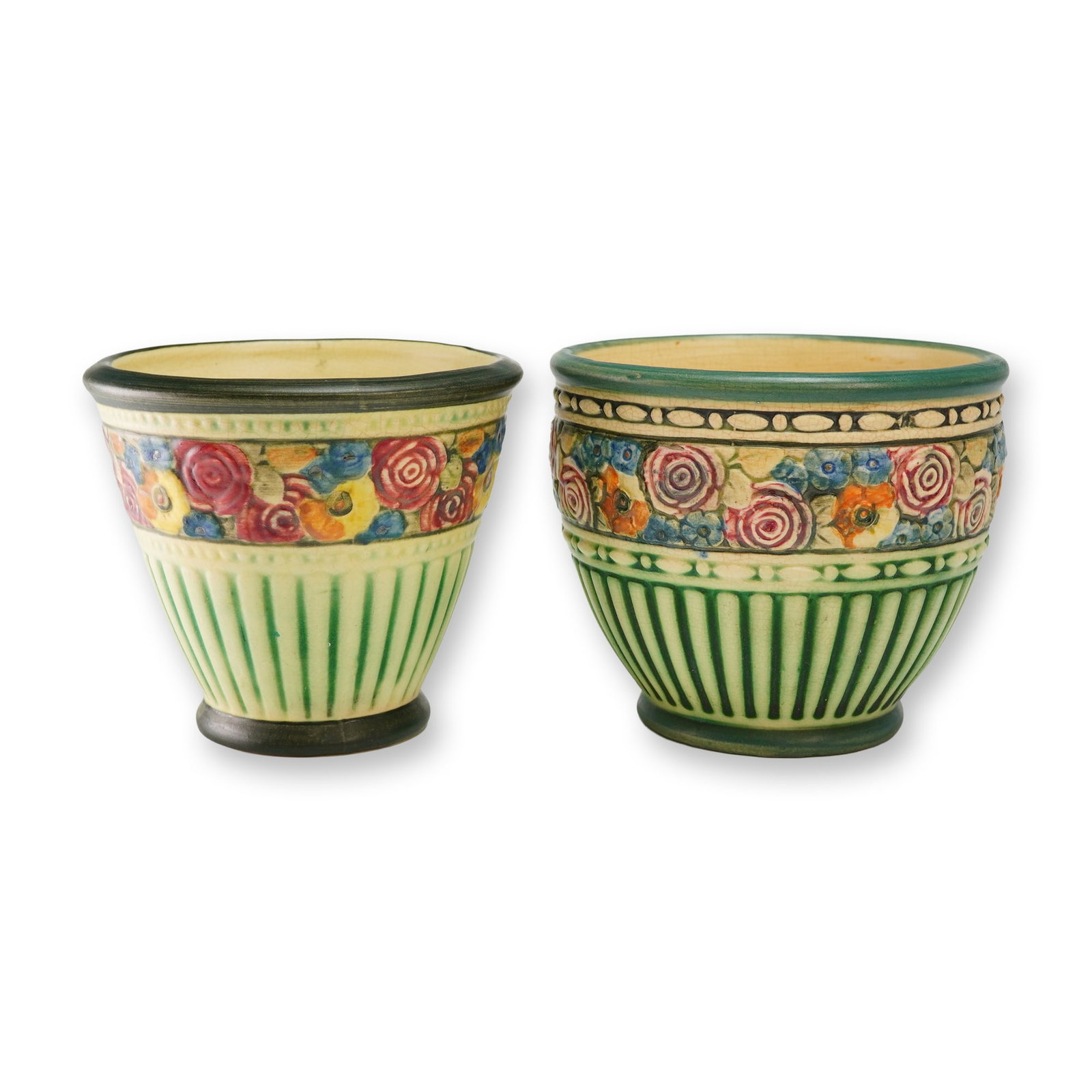 Two Weller Pottery Planter Pots, Chelsea Eldora: These glazed ceramic planters feature hand-painted floral bands with stylized blossoms in red, yellow, and blue tones against a cream ground. The lower sections exhibit molded vertical ribbing highlig