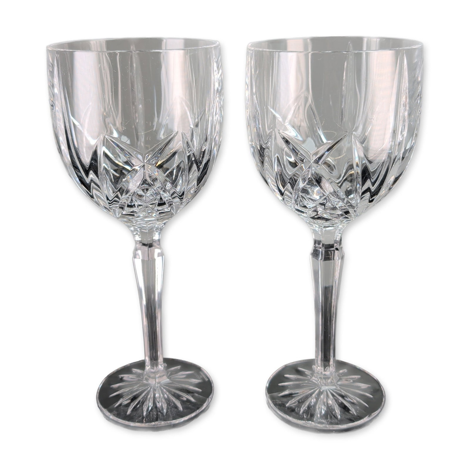Pair of Marquis by Waterford Brookside Crystal Water Goblets: Marquis by Waterford. Pair of water goblets in crystal, featuring the Brookside pattern with deep crisscross diamond and vertical wedge cuts. Faceted hexagonal stems terminate in circular feet with