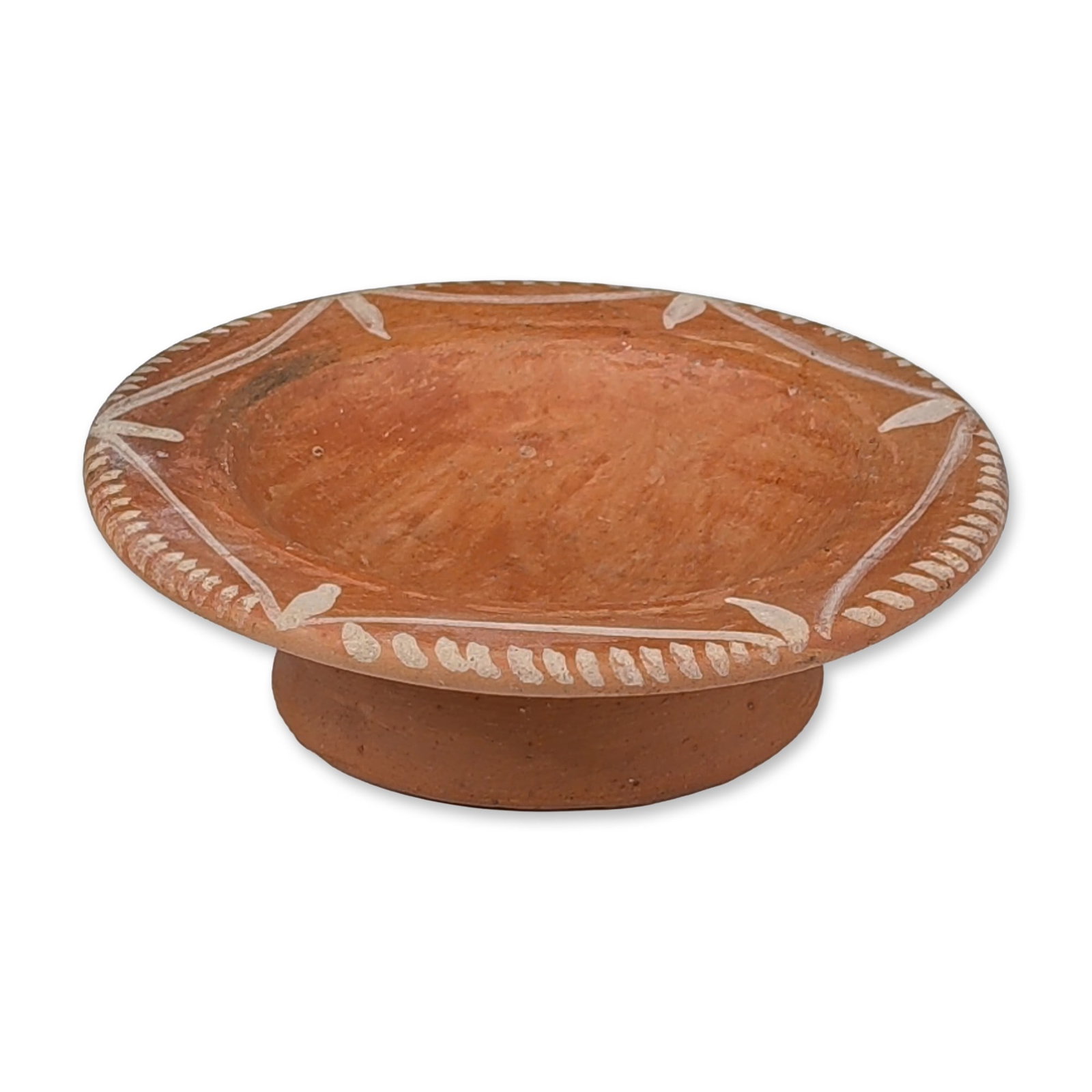 Pre-Columbian White-on-Red Earthenware Pedestal Dish: The vessel features a shallow central well with a wide, flared rim supported by a cylindrical pedestal foot. The rim is decorated with a hand-painted geometric pattern in white slip, consisting of a c