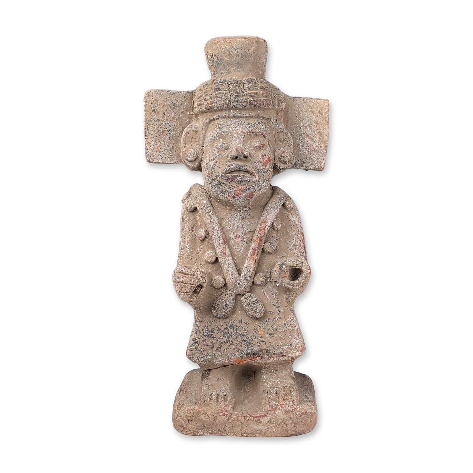 Pre-Columbian Terracotta Figurine: A deity figurine in hand-modeled terracotta with applied ornaments and traces of red and black pigment. The figure is depicted in a formal, frontal pose wearing a monumental headdress composed of a