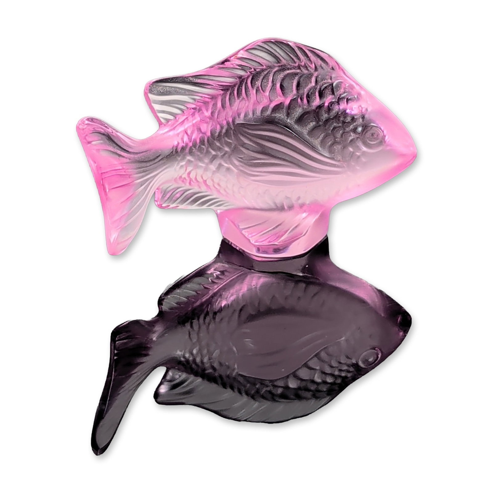 Lalique Fuchsia Crystal Fish Figurine: French molded crystal figurine of a stylized fish in a fuchsia colorway. The model features a satin-finished body with polished highlights along the edges of the fins and tail. The piece bears an etch