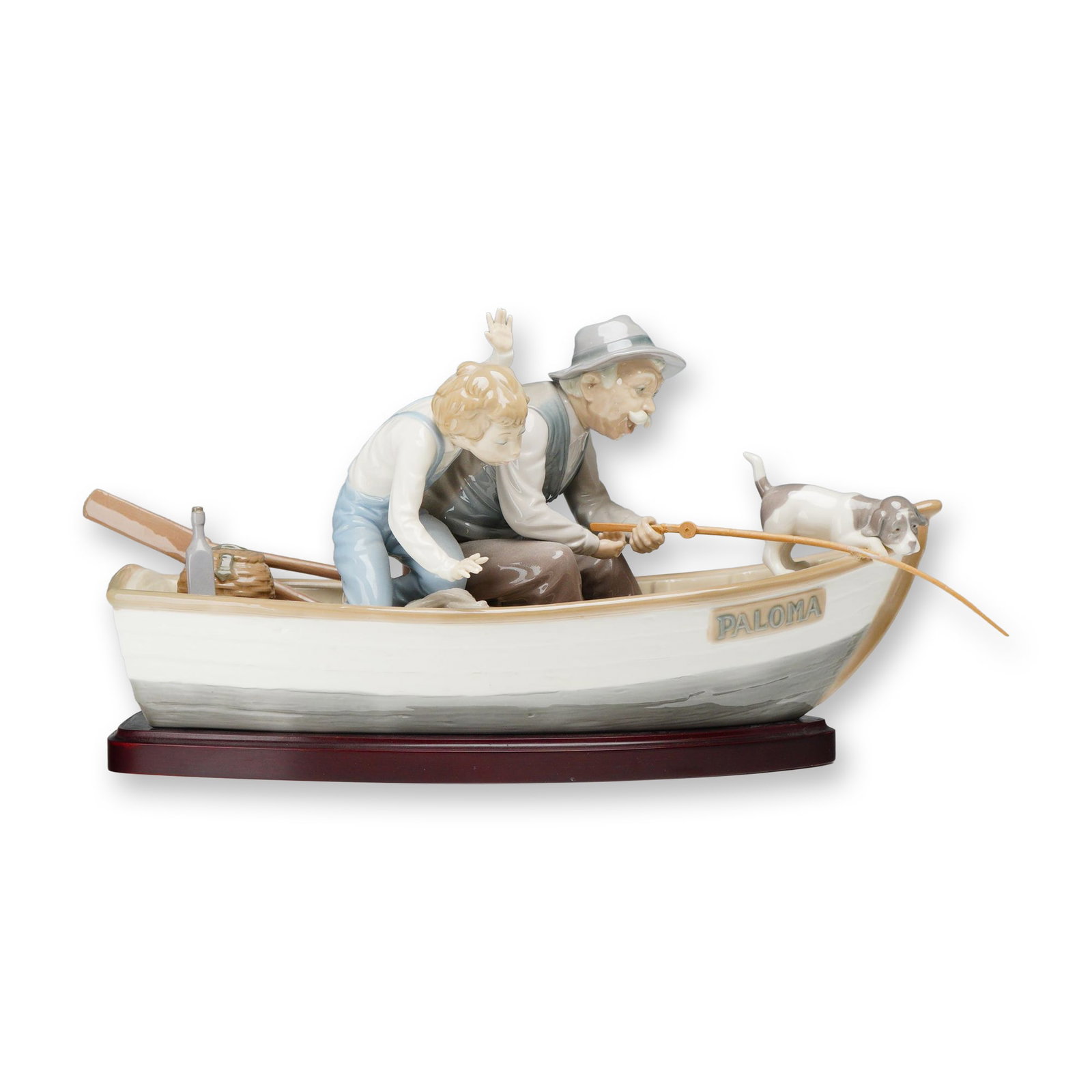 Lladro Fishing with Gramps Porcelain Figurine 5215 with Base: Lladro (Spanish) glazed porcelain figurine titled Fishing with Gramps, model number 5215, sculpted by Jose Puche. The scene depicts an elderly man and a young boy fishing from a rowboat named PALOMA, 