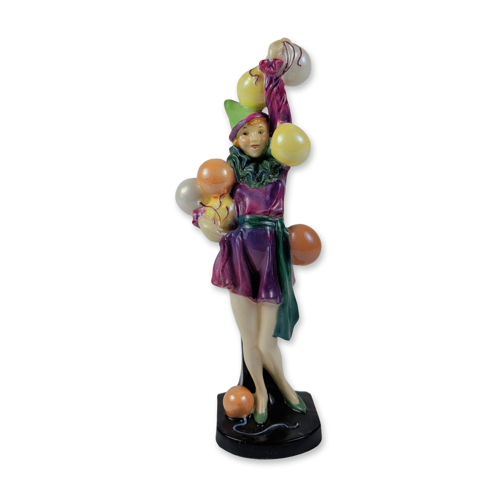 Royal Doulton Porcelain Figurine, Folly HN 1335: Features a woman in a stylized jester costume with a purple bodice, green ruffled accents, and a matching pointed hat. The figure is depicted holding clusters of iridescent yellow, orange, and white b