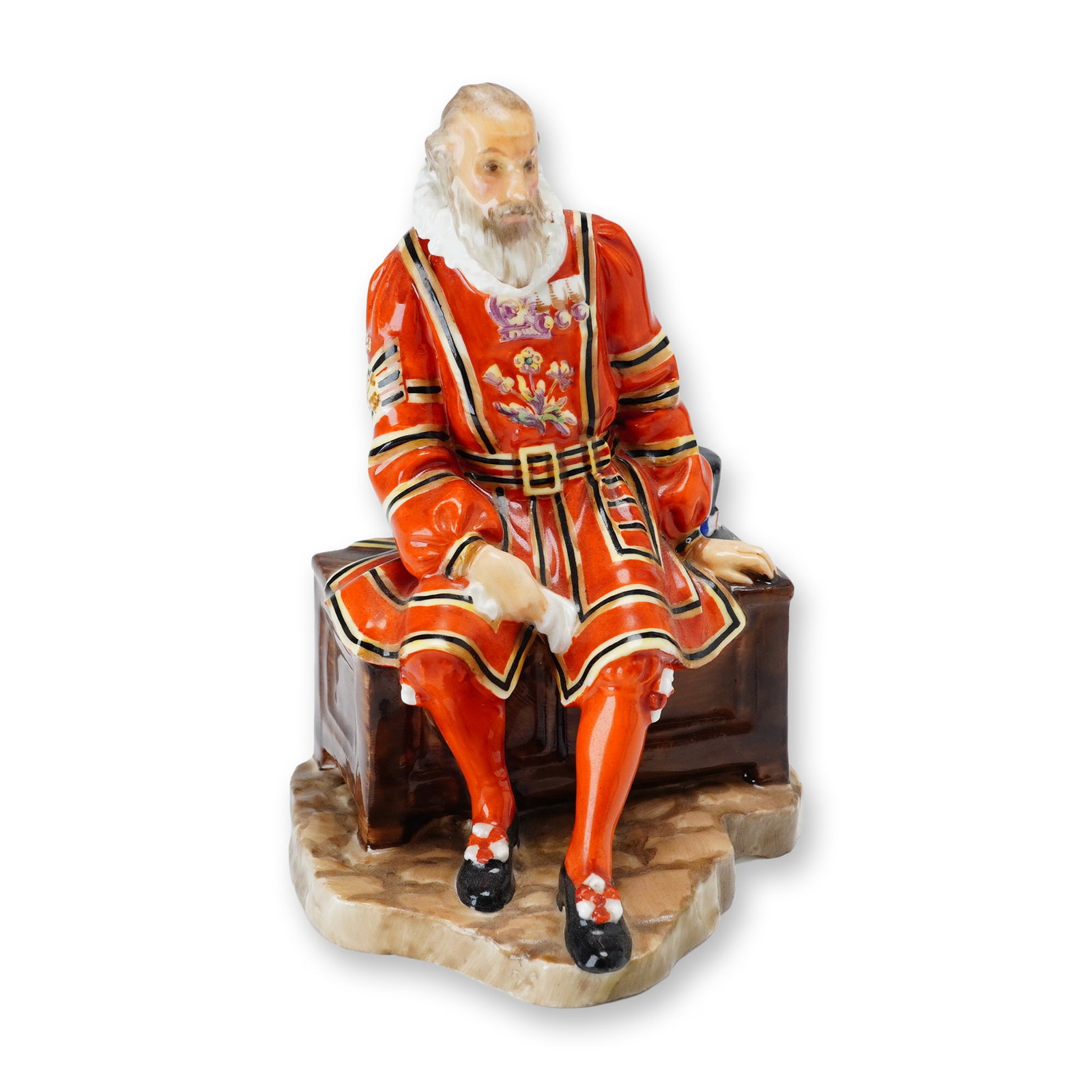 Royal Doulton Porcelain Figurine, A Yeoman of the Guard HN688: Designed by Leslie Harradine, this hand-painted figure depicts a Yeoman Warder of the Tower of London, commonly known as a Beefeater. The figure is rendered in traditional ceremonial attire and bears 
