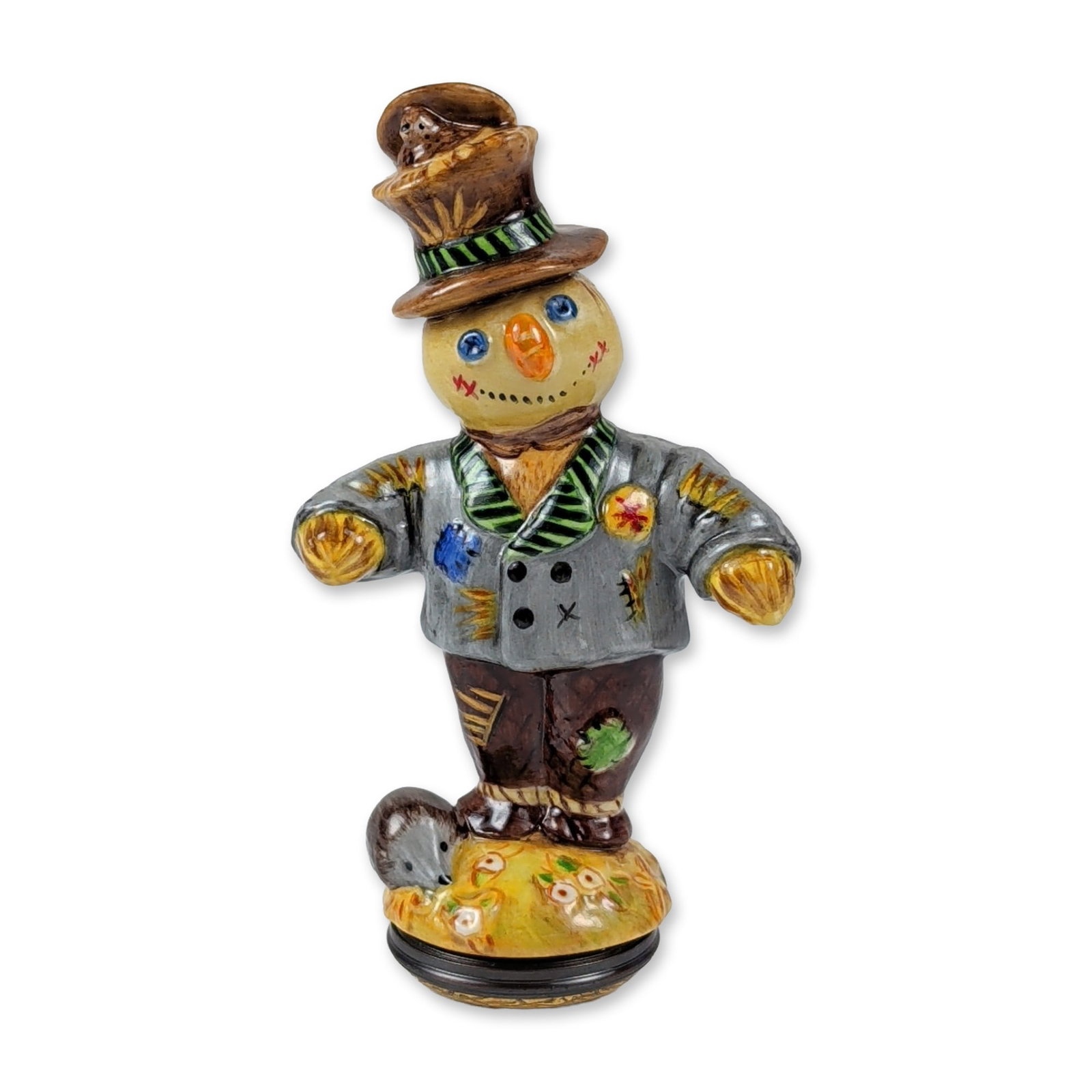 Halcyon Days Hand-Painted Glazed Ceramic Scarecrow Figurine: Whimsical hand-painted glazed ceramic figurine depicting a characterful scarecrow in a standing pose. The figure wears a weathered brown top hat with straw accents, a grey jacket with colorful patches