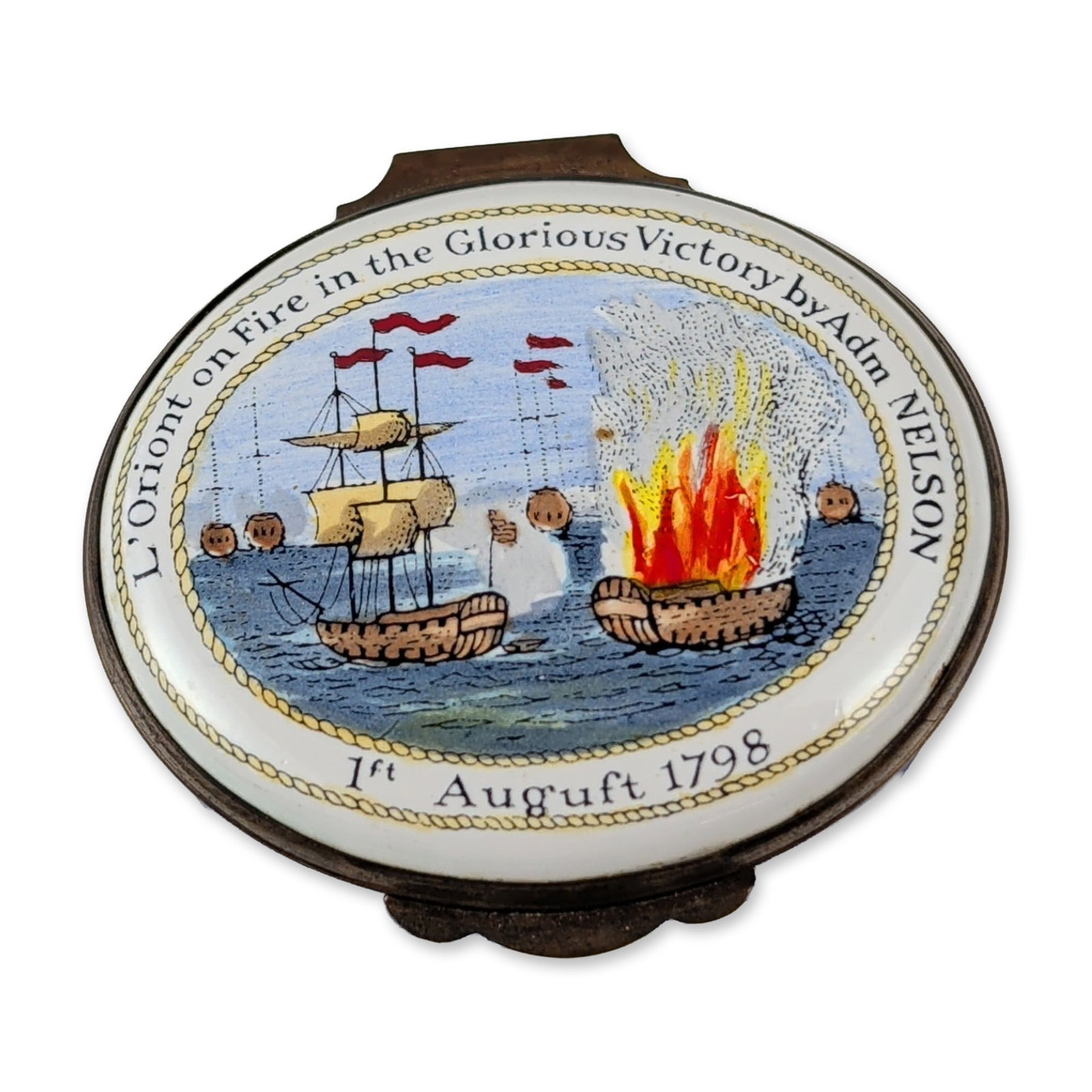 Halcyon Days English Enamel Admiral Nelson Commemorative Box: Contemporary English commemorative enamel box by Halcyon Days, London. Circular form with a cobalt blue enamel base, hinged domed lid, and gold-tone metal mounts featuring a scalloped thumbpiece. The 
