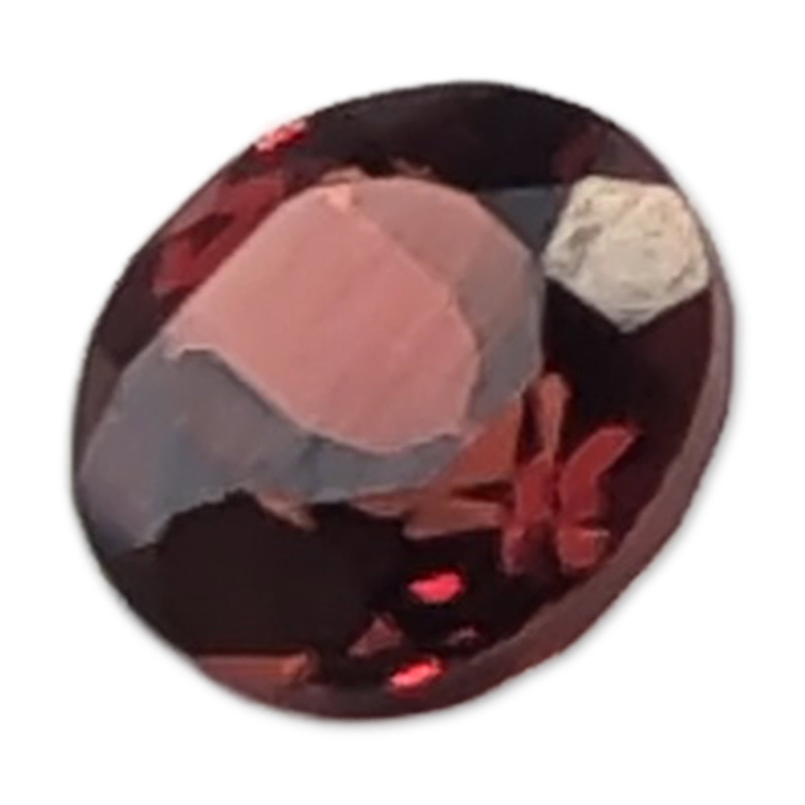 Oval Cut Deep Red Garnet Gemstone: Loose faceted red garnet gemstone. Oval brilliant cut featuring deep brownish-red to purple-red color saturation with symmetrical faceting and high transparency. No significant internal inclusions vis