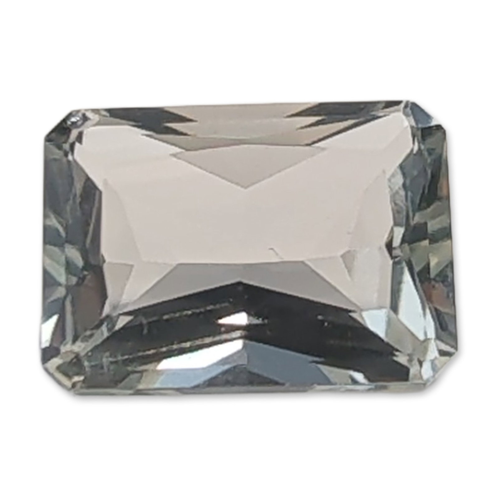 Rectangular Emerald Cut Light Blue Quartz Gemstone: Loose faceted quartz gemstone, featuring an icy blue to pale green tint. The stone is worked in a rectangular step-cut or emerald cut, displaying high transparency and brilliant light return. Facet