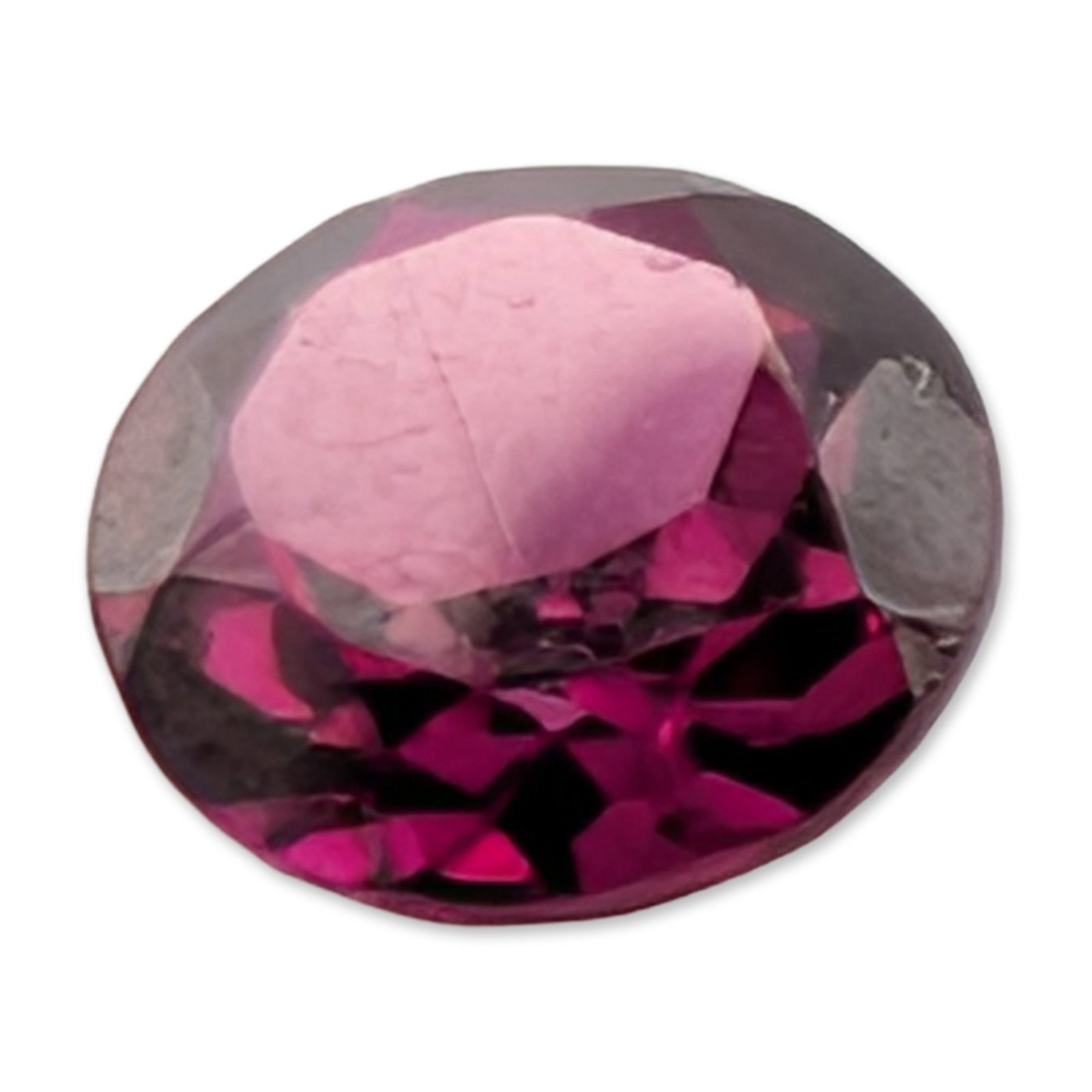 Loose Oval Cut Purplish-Red Ruby Gemstone: A single loose faceted ruby gemstone, featuring a vibrant purplish-red hue. The stone is worked into an oval brilliant or mixed cut, characterized by a flat table and a faceted pavilion. Visual