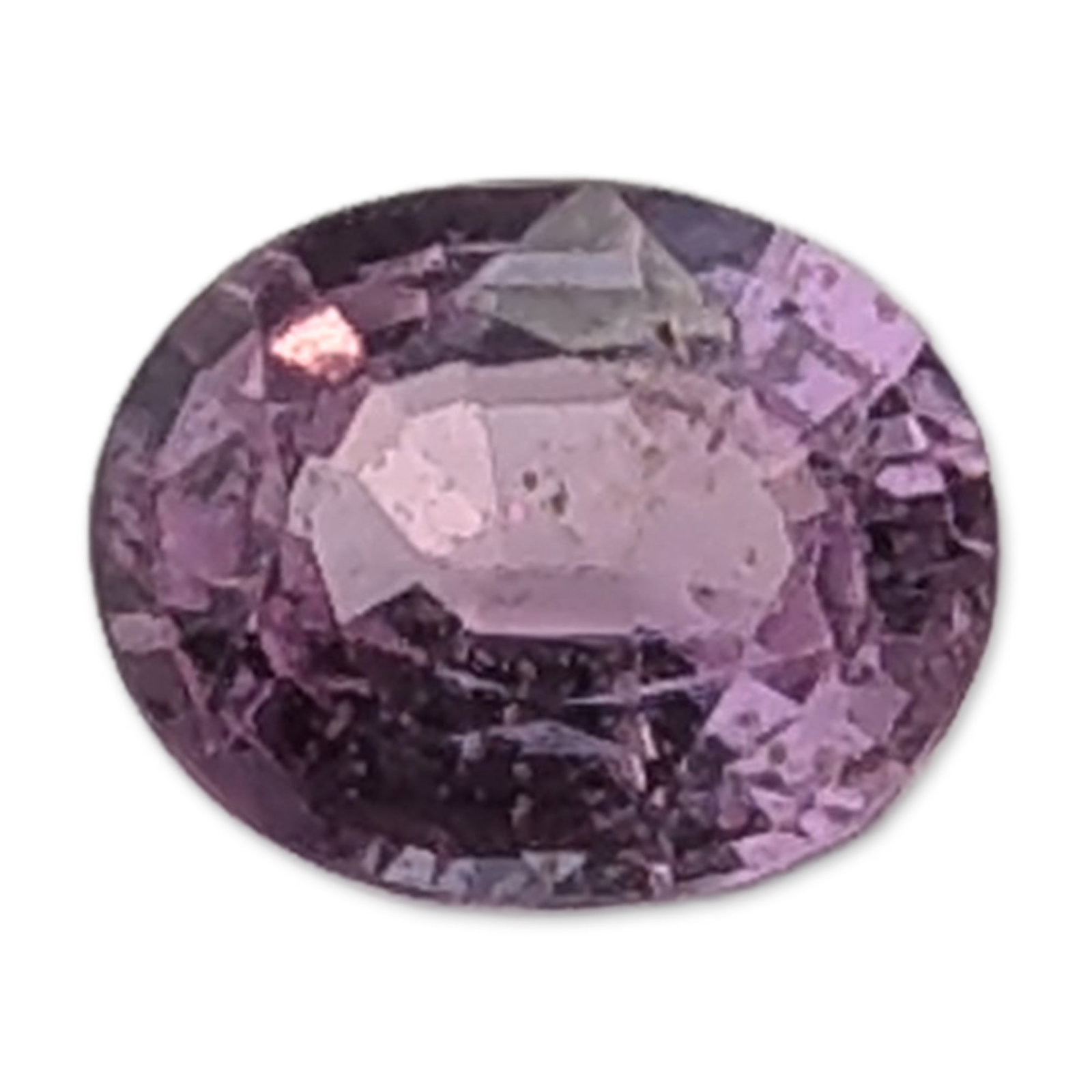 Oval Cut Pink Sapphire Loose Gemstone: Oval faceted pink sapphire loose gemstone, appears to be corundum. The stone exhibits a light lilac-pink hue and features a shallow faceted cut with a visible central window. Internal characteristics 