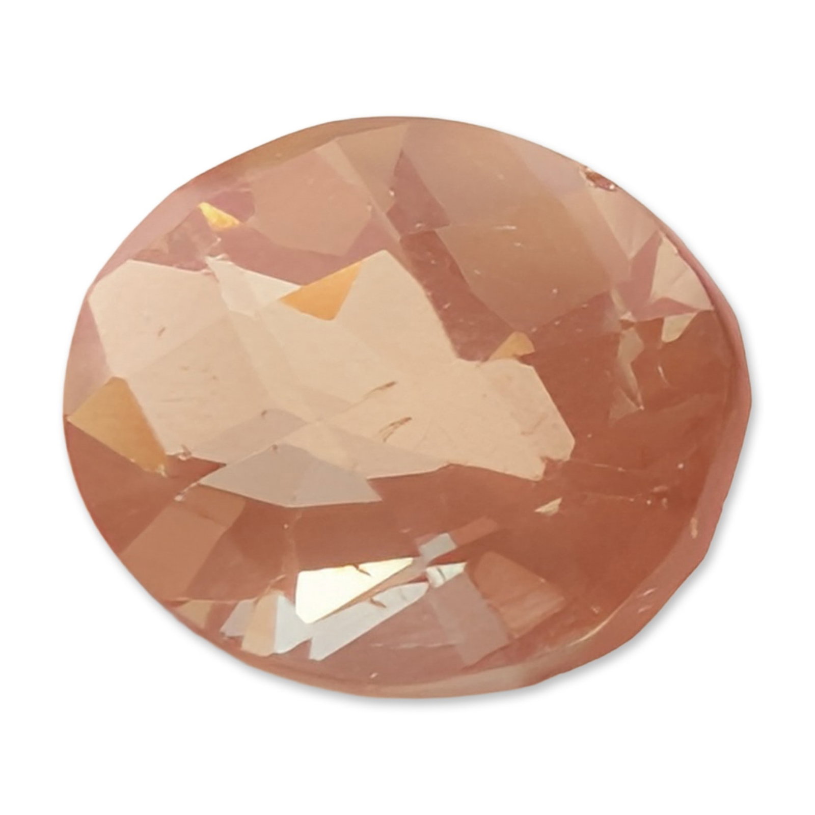 Oval Faceted Peach Colored Loose Sunstone Gemstone: Single loose faceted sunstone gemstone in an oval cut. The specimen displays a salmon-pink to light apricot hue. The stone is cut with a faceted crown and pavilion. Internal inclusions including fine