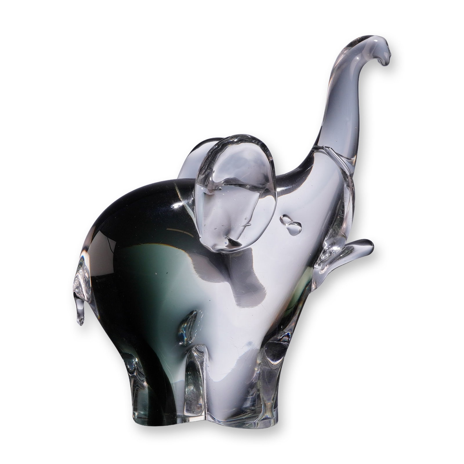 Murano Style Hand Blown Art Glass Elephant Figurine: This is a Murano-style hand blown art glass elephant figurine, characterized by a mid-century modern aesthetic. The piece depicts an elephant in a trumpeting pose with its trunk raised and one front l