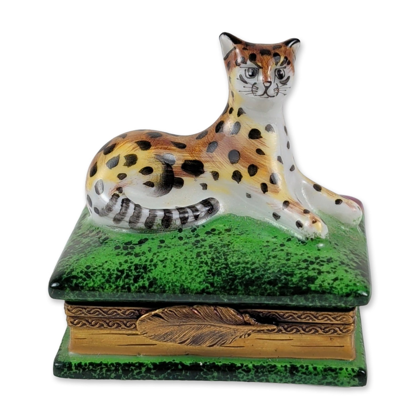 Dubarry Limoges Porcelain Leopard Book Trinket Box: Dubarry Limoges hinged trinket box in hand-painted porcelain, modeled as two stacked books. The top book features a green speckled cover surmounted by a three-dimensional seated leopard figure, while 