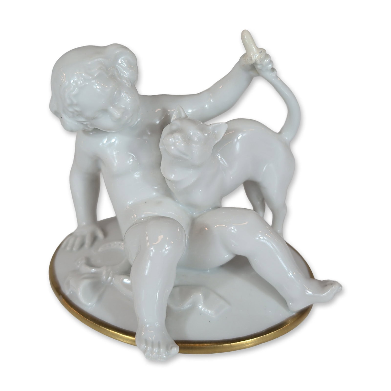 Rosenthal Porcelain Figurine by Karl Oppel, Putto with a Cat: Rosenthal porcelain figurine in white glazed porcelain, featuring a kneeling putto or young child pulling the tail of a small feline cub, possibly a leopard or panther cub. The underside bears the gre