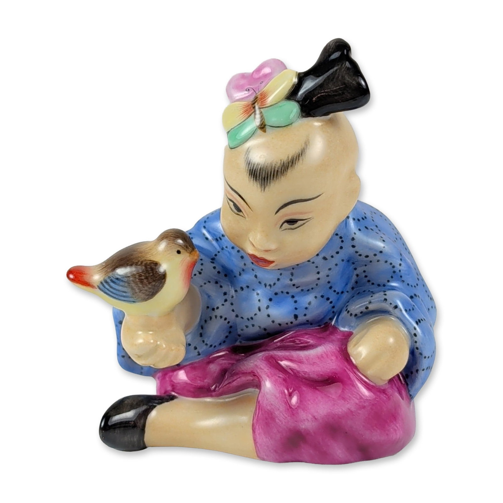 Herend Hungarian Hand-painted Porcelain Chinese Girl: Herend Hungarian hand-painted porcelain figurine depicting a seated girl in Chinoiserie attire holding a small bird. The figure is dressed in a blue tunic with a black dotted pattern, magenta trousers
