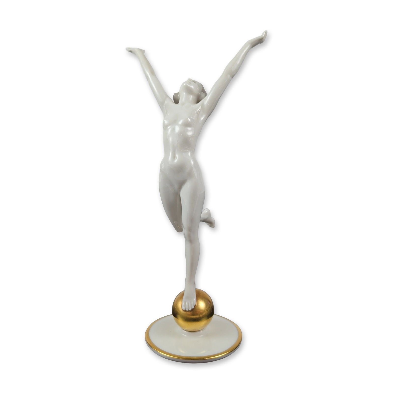 Hutschenreuther Karl Tutter Porcelain Nude Figurine: This Hutschenreuther Art Department glazed white porcelain figurine is titled The Sun Child and was designed by Karl Tutter. The striking piece depicts a nude female figure in a dynamic pose, elegantl