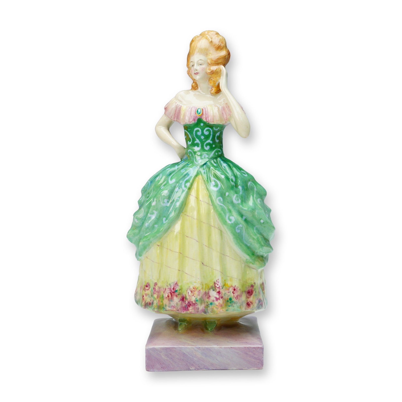Leslie Johnson Studio Production Figurine, Lady in Green Dress: Hand-painted studio figurine depicting an elegant lady in a green and yellow gown with pink accents and floral hem detail. The figure features fine detailing to the bodice and skirt, with a raised han