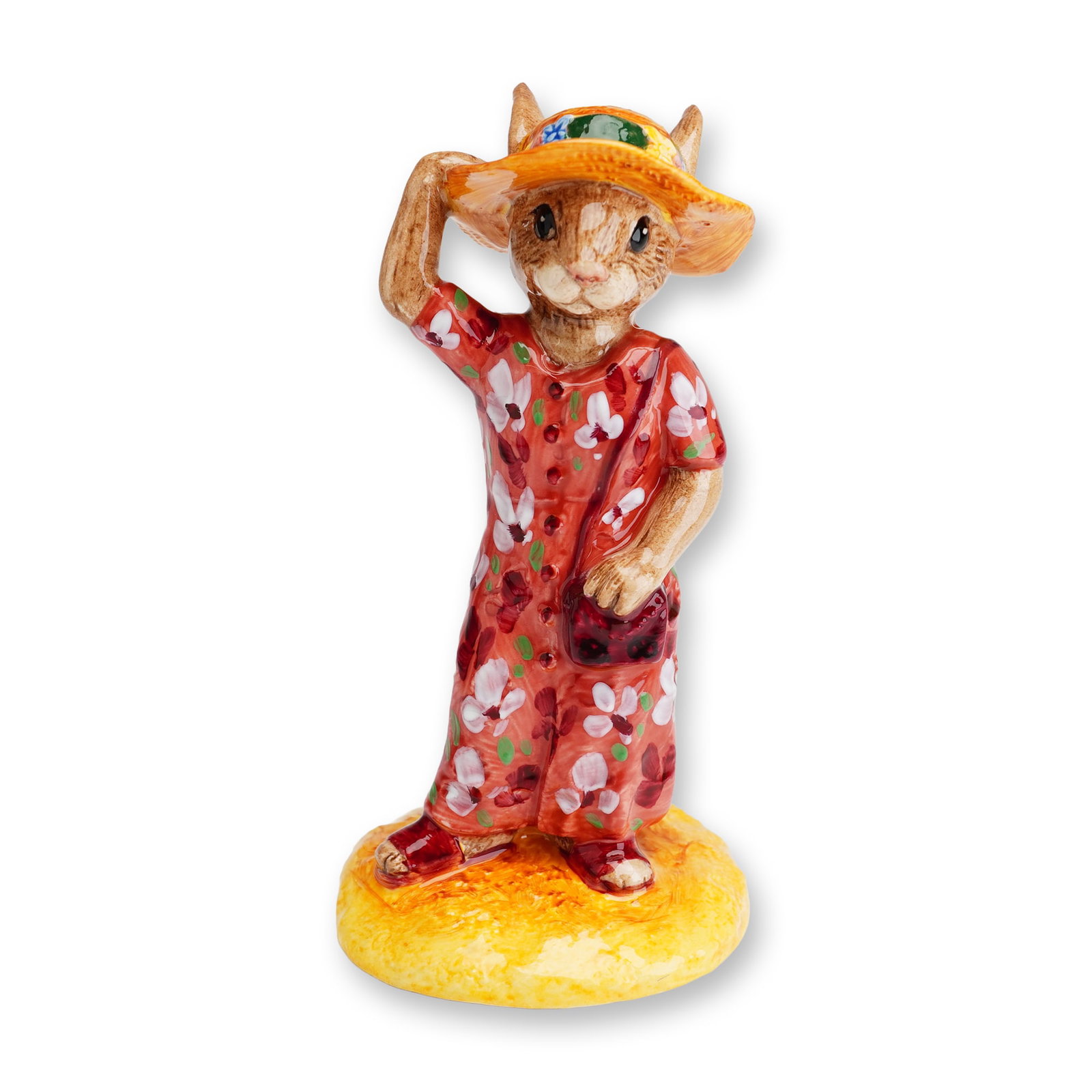 Royal Doulton Bunnykins Special Colorway Figurine, Sightseer DB215: A Royal Doulton Bunnykins ceramic figurine titled Sightseer, model number DB215. This anthropomorphic female rabbit is depicted standing on a textured circular base finished in a yellow-orange glaze. 
