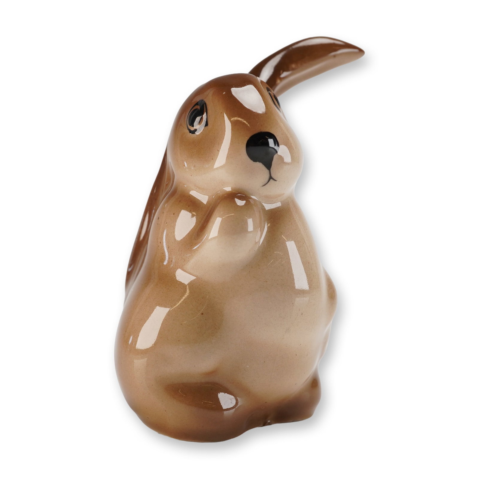 Royal Doulton Figurine, Lop-Eared Rabbit: A rare unusual size porcelain Royal Doulton animal figure. The figure depicts a seated rabbit with the left ear raised, finished in glossy light brown with black eyes and nose. Backstamp and model num