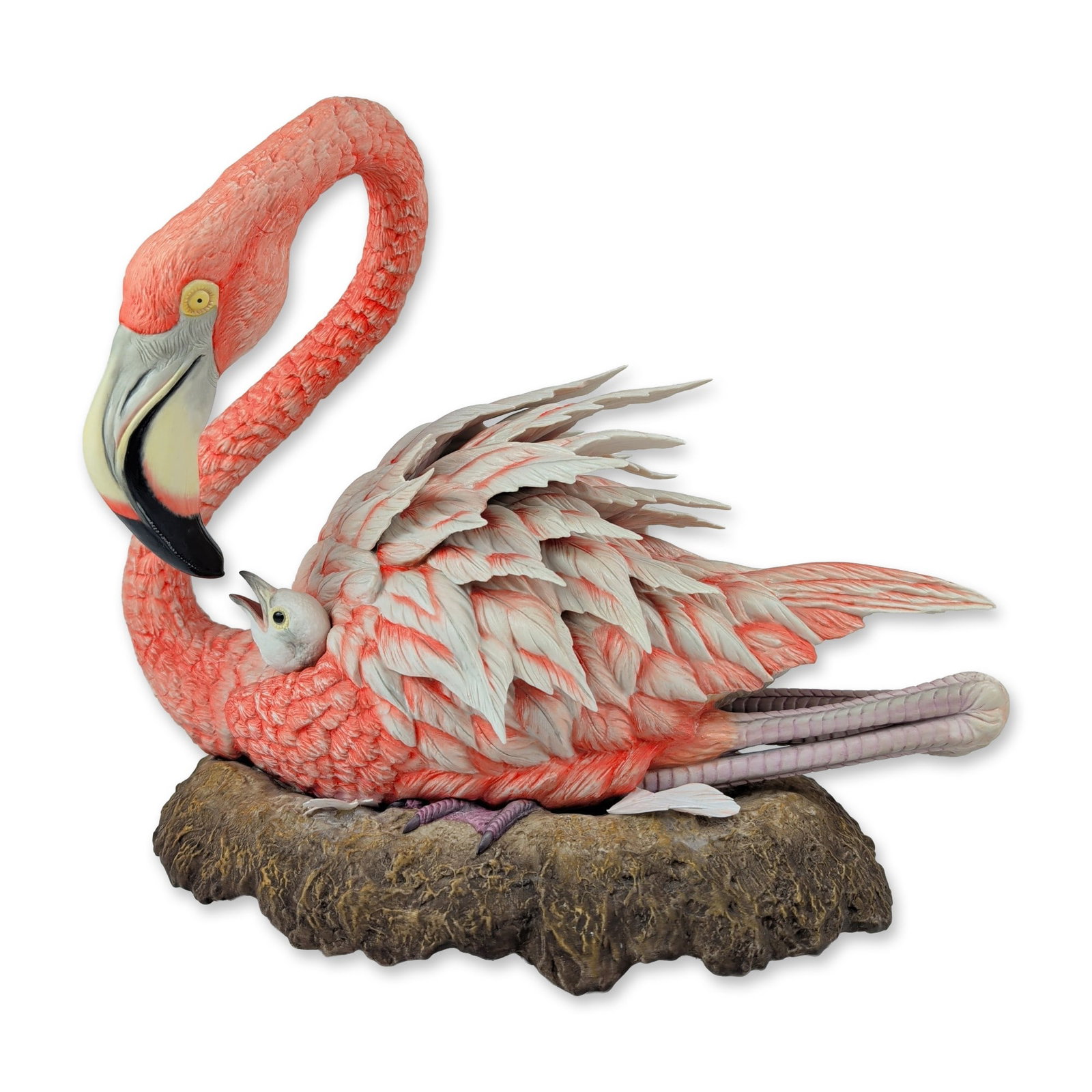 Boehm Audubon Porcelain Flamingo Sculpture, Signed: This hand-painted American bisque porcelain sculpture depicts a mature nesting flamingo with a newborn chick emerging from its feathers, modeled resting on an earth-toned, rock-form base. Issued in 19