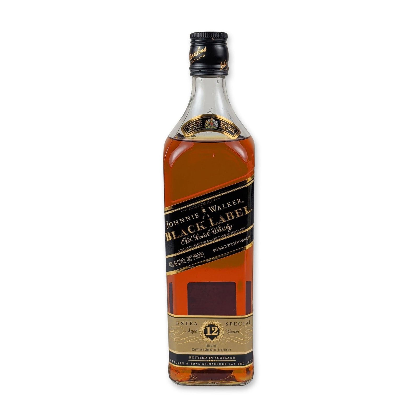 Johnnie Walker Black Label Extra Special Aged 12 Years: This vintage 1990 export bottling of Johnnie Walker Black Label Blended Scotch Whisky is bottled at 40% ABV (80 proof). The iconic square glass vessel features its classic diagonal black main label ac