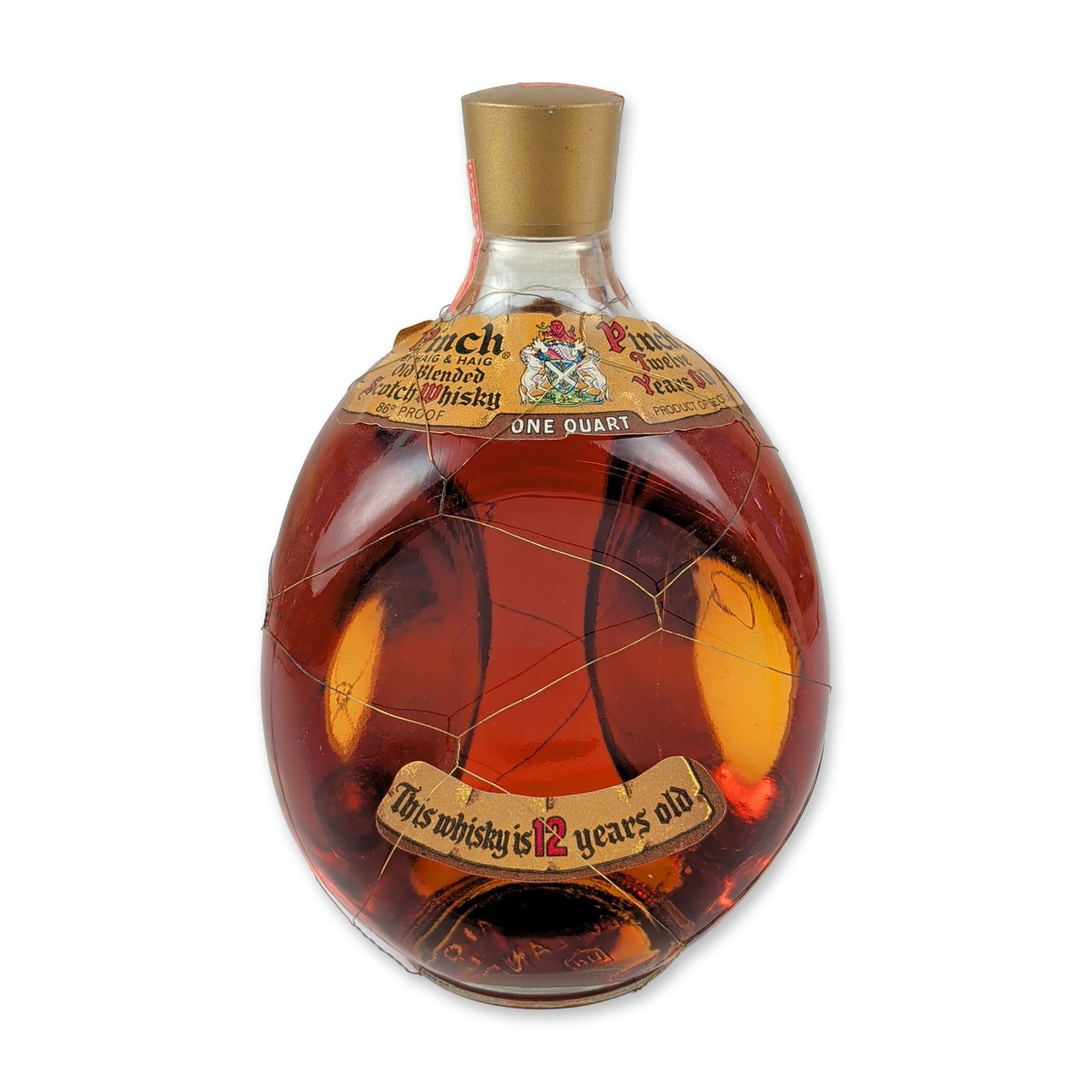 Pinch 12-Year-Old Blended Scotch Whisky: This vintage 1970s One Quart expression is bottled at 86.8 proof and features the signature three-sided dimpled glass bottle wrapped in an intact wire mesh cage. The gold-tone cap is secured beneath a